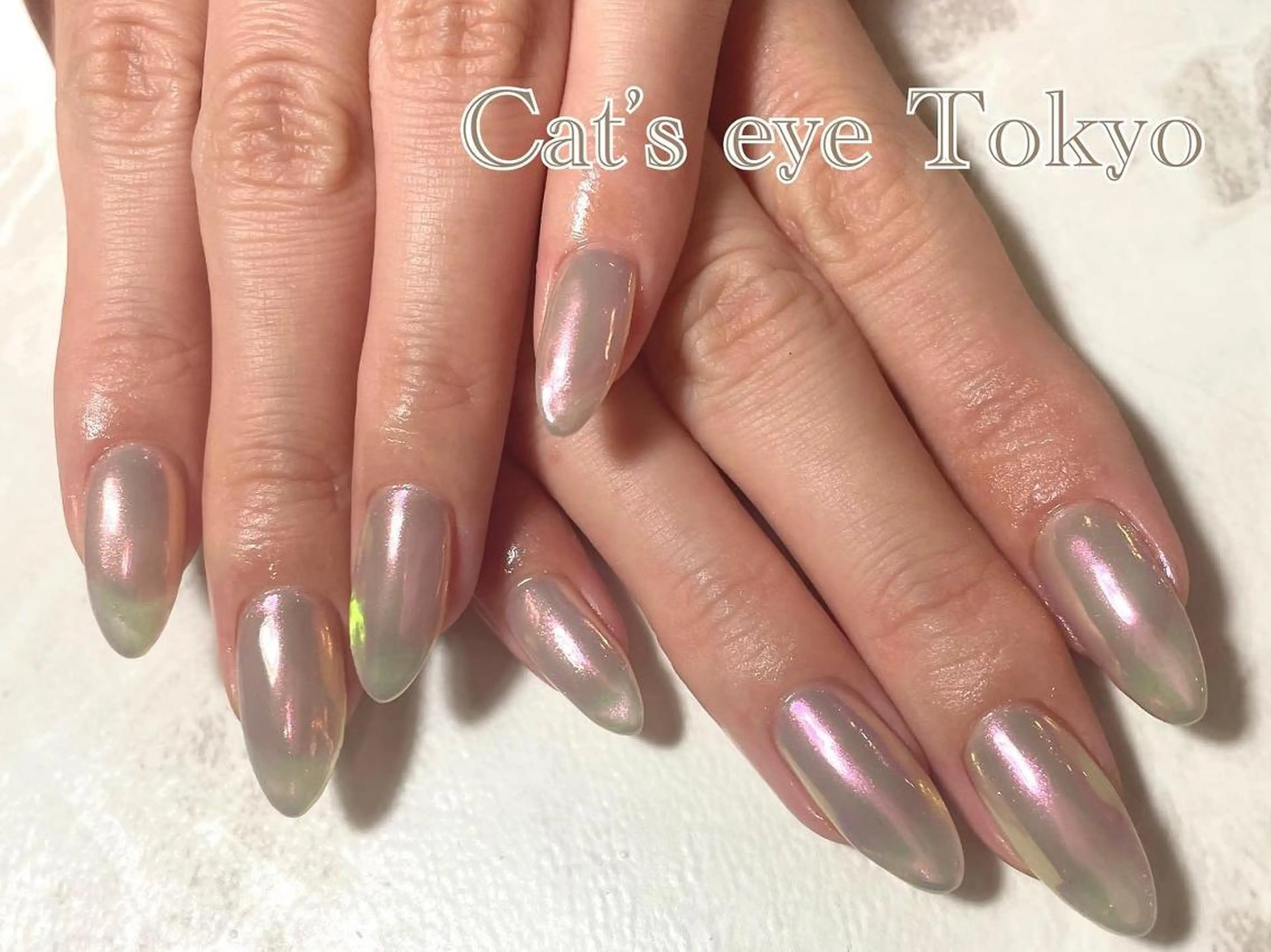ネイル マツエク・マツパ カラーマツエク オーロラネイル ワンカラーネイル ピンク Cat's eye TOKYO 新宿店のネイルデザイン