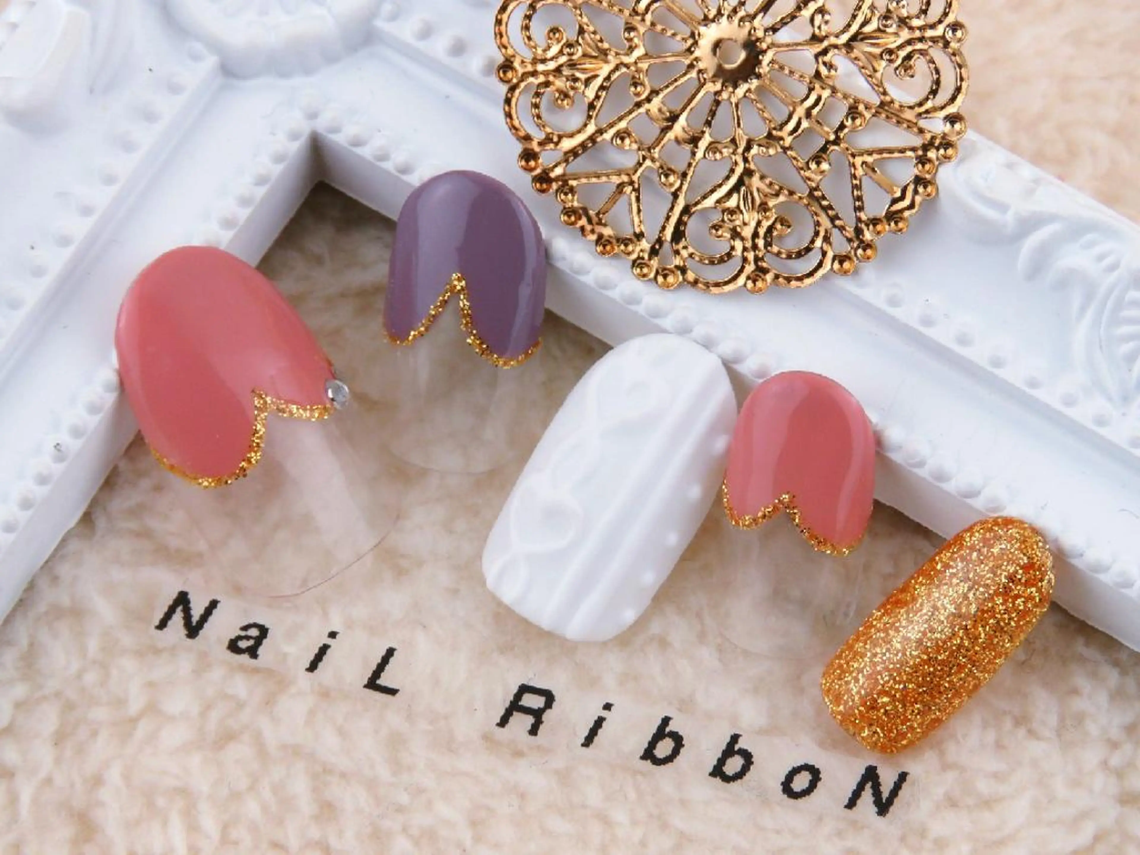ネイル ネイルリボン 受付スタッフのネイルデザイン