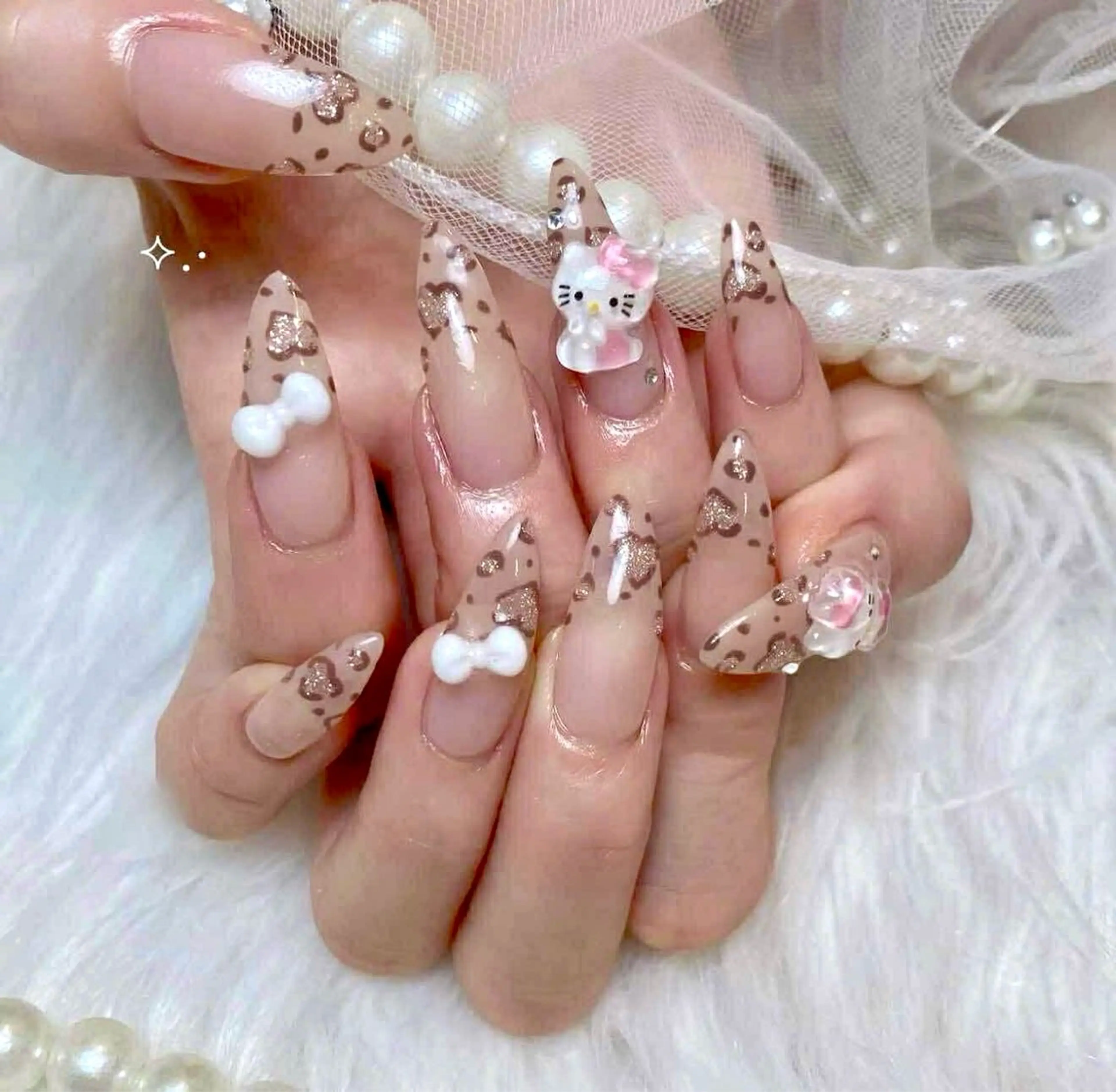 ネイル キラキラネイル 韓国ネイル ロングネイル リボン ストーンネイル ハンドネイル Haruki Nail Salonのネイルデザイン