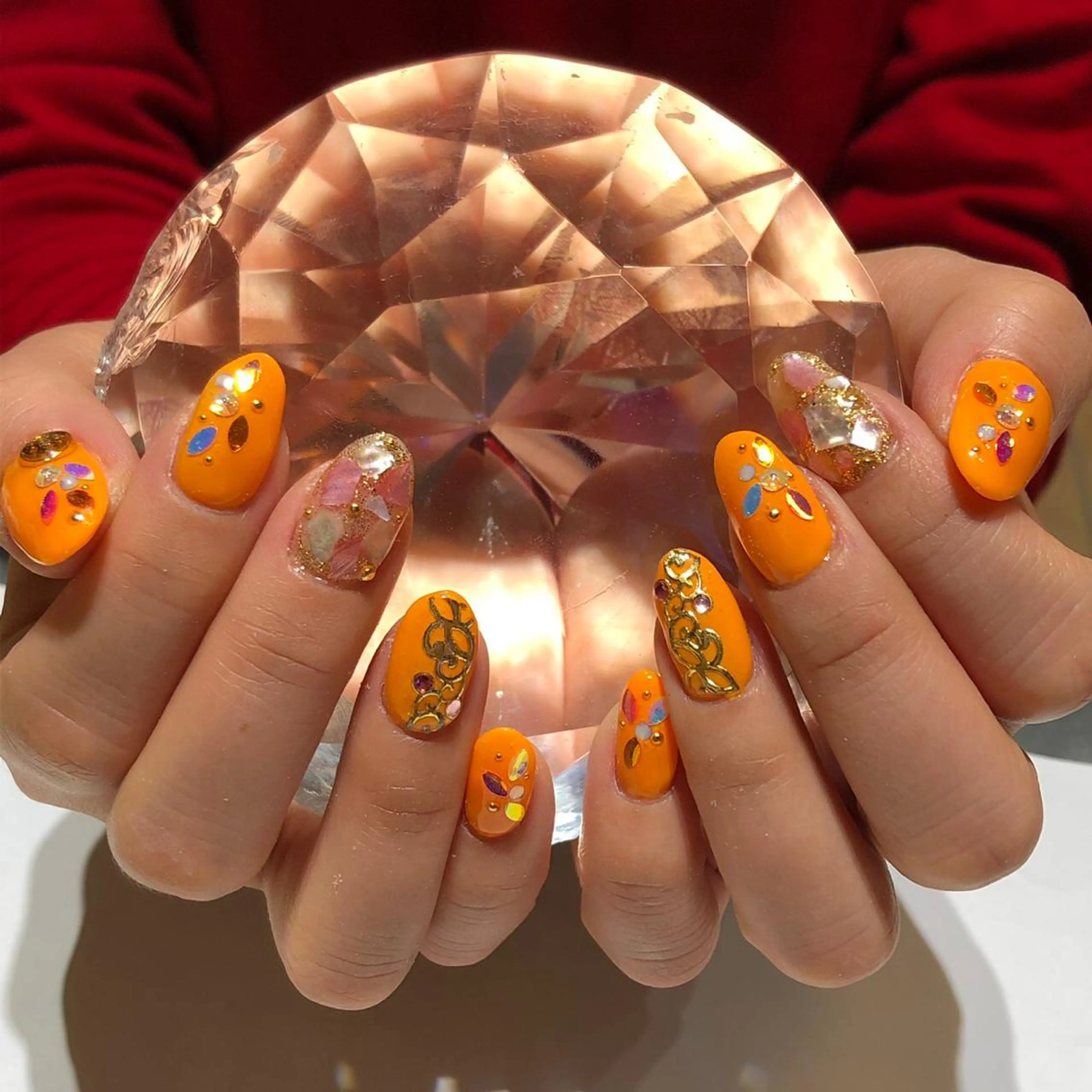 ネイル キラキラネイル オレンジ YUN 💅のネイルデザイン