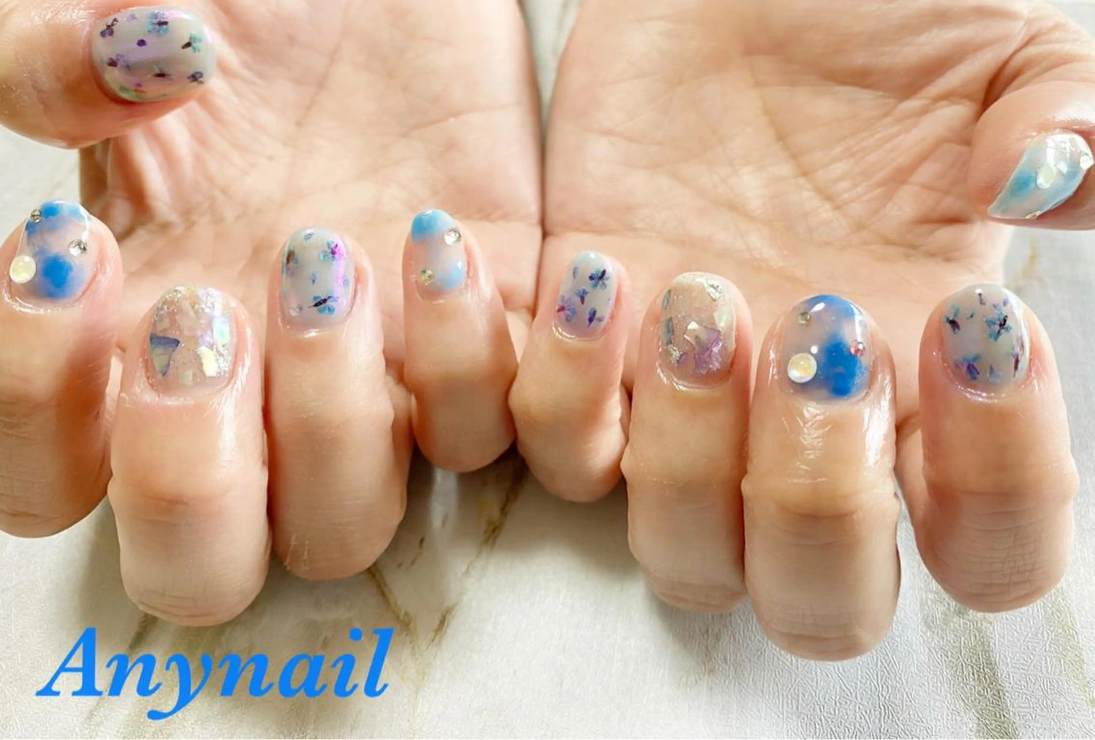 ネイル オーロラネイル ブルー クリアネイル フラワーネイル キラキラネイル ハンドネイル 岩澤 恵子のネイルデザイン