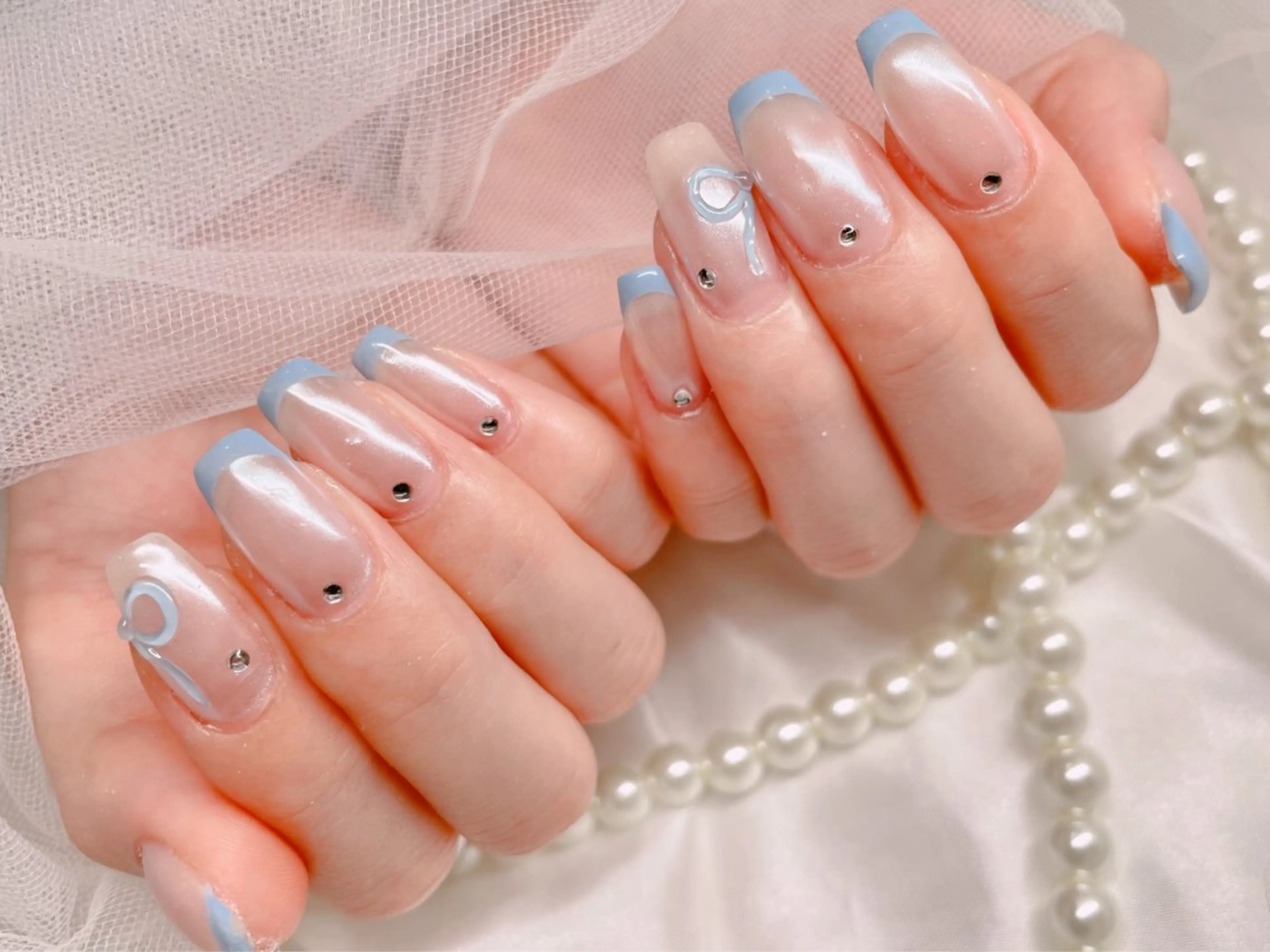 ネイル 水色 ミラーネイル リボン ハンドネイル ゆりか ジョアアンジェ福島のネイルデザイン