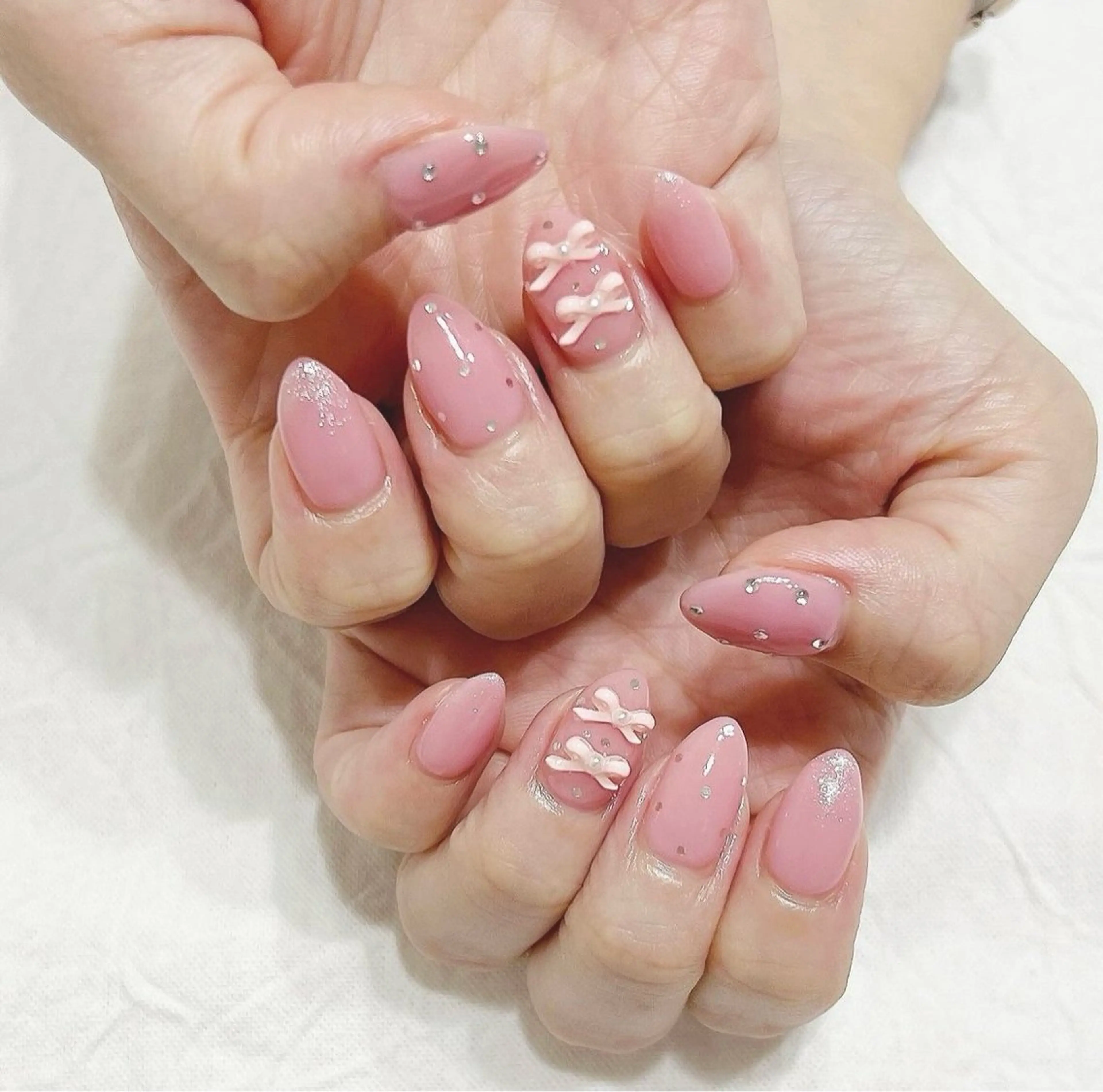 ネイル ピンク リボン シルバー ストーンネイル ハンドネイル peaberry nailのネイルデザイン