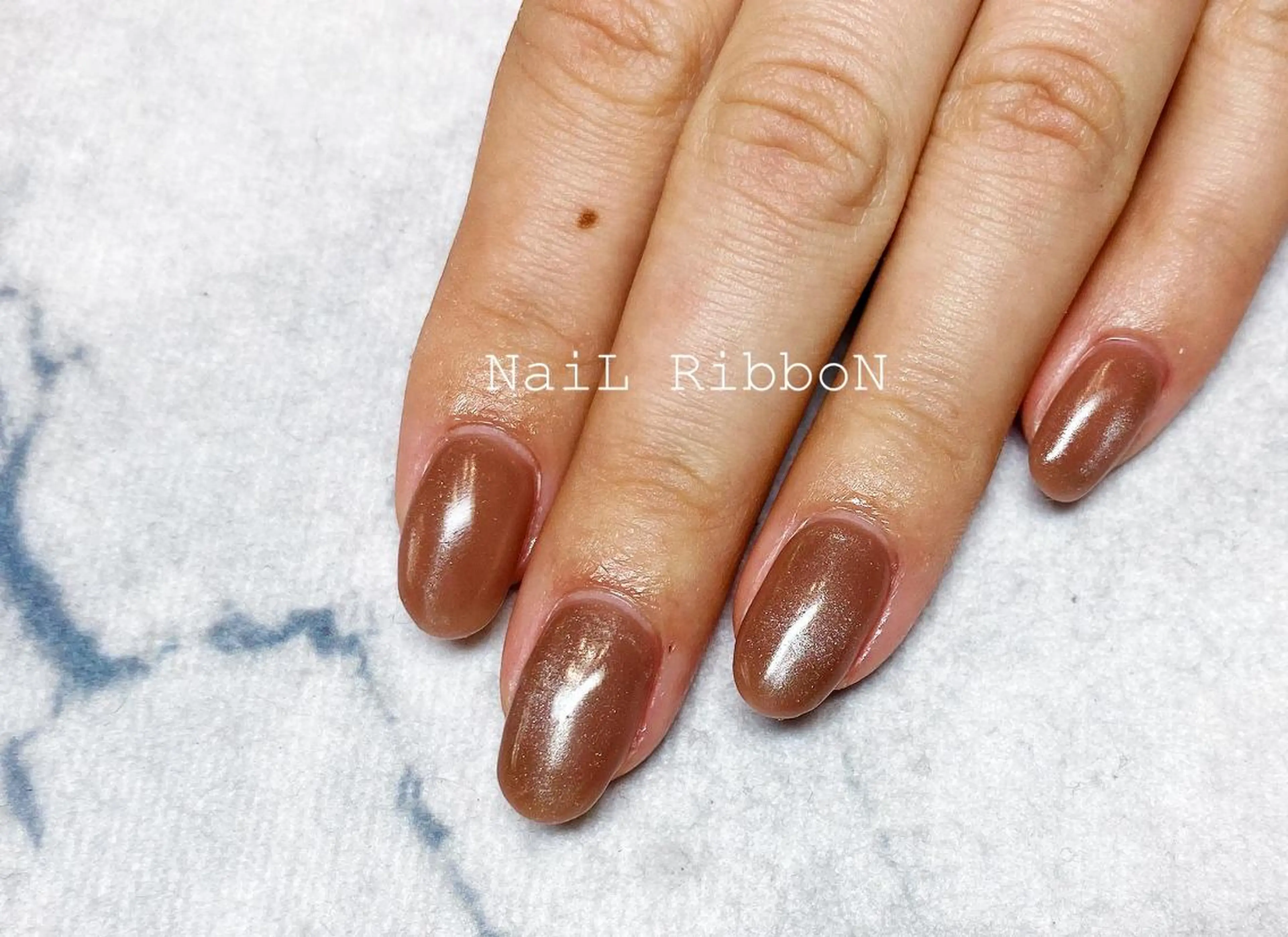 ネイル ネイルリボン 受付スタッフのネイルデザイン