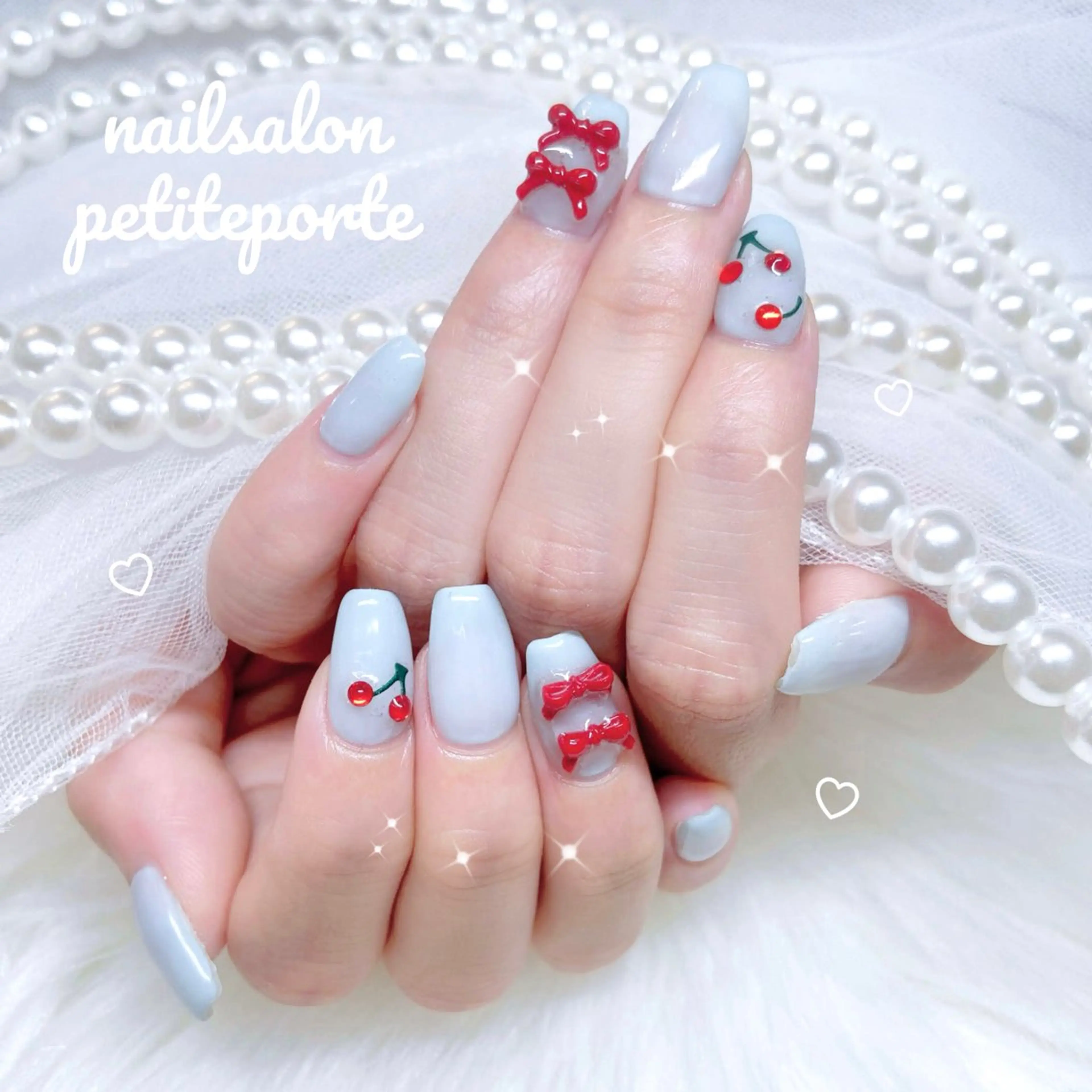 ネイル ガーリー 韓国ネイル 水色 リボン シンプルネイル ハンドネイル petite porteのネイルデザイン