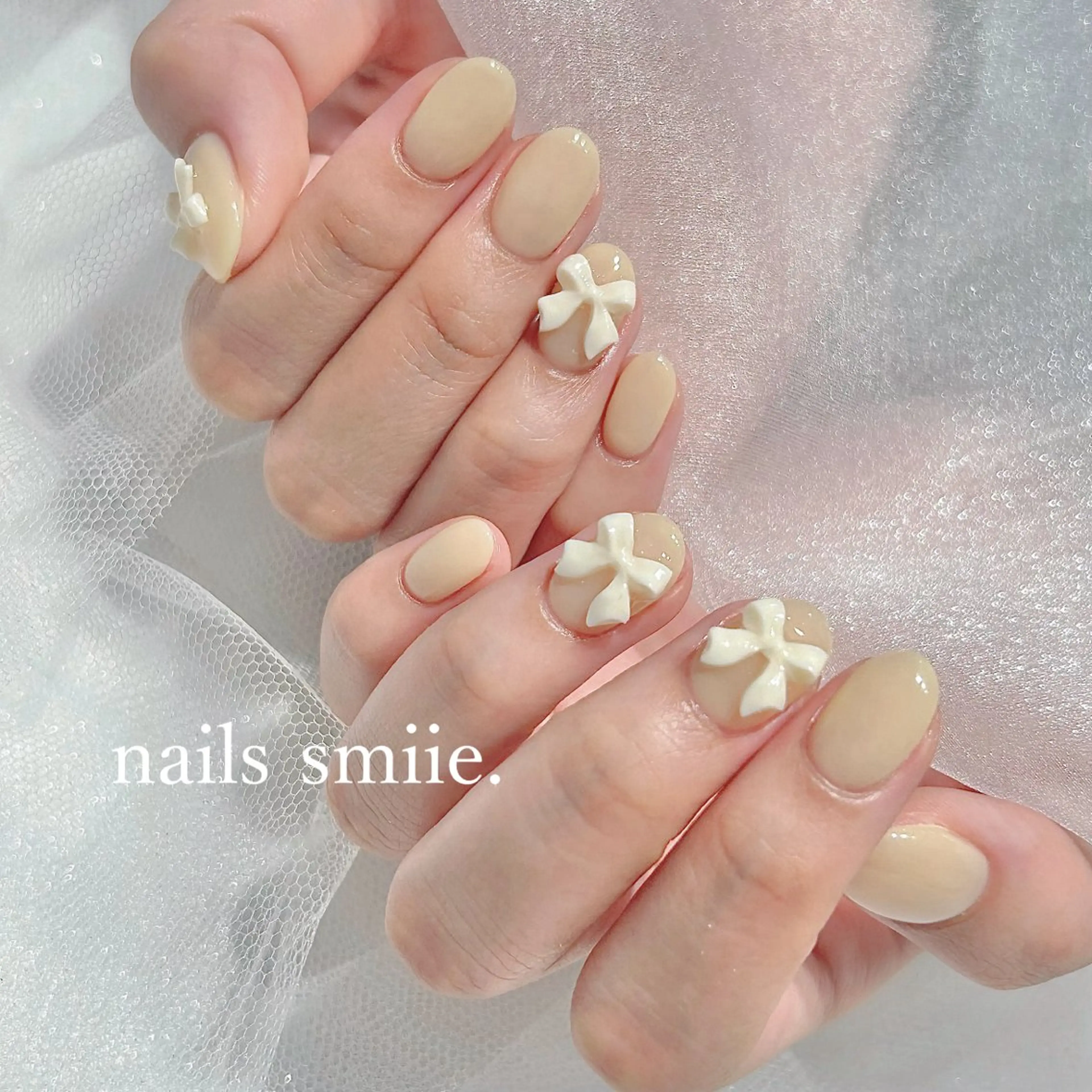 ネイル ワンカラーネイル リボン シンプルネイル 黄色 nails smiie.のネイルデザイン