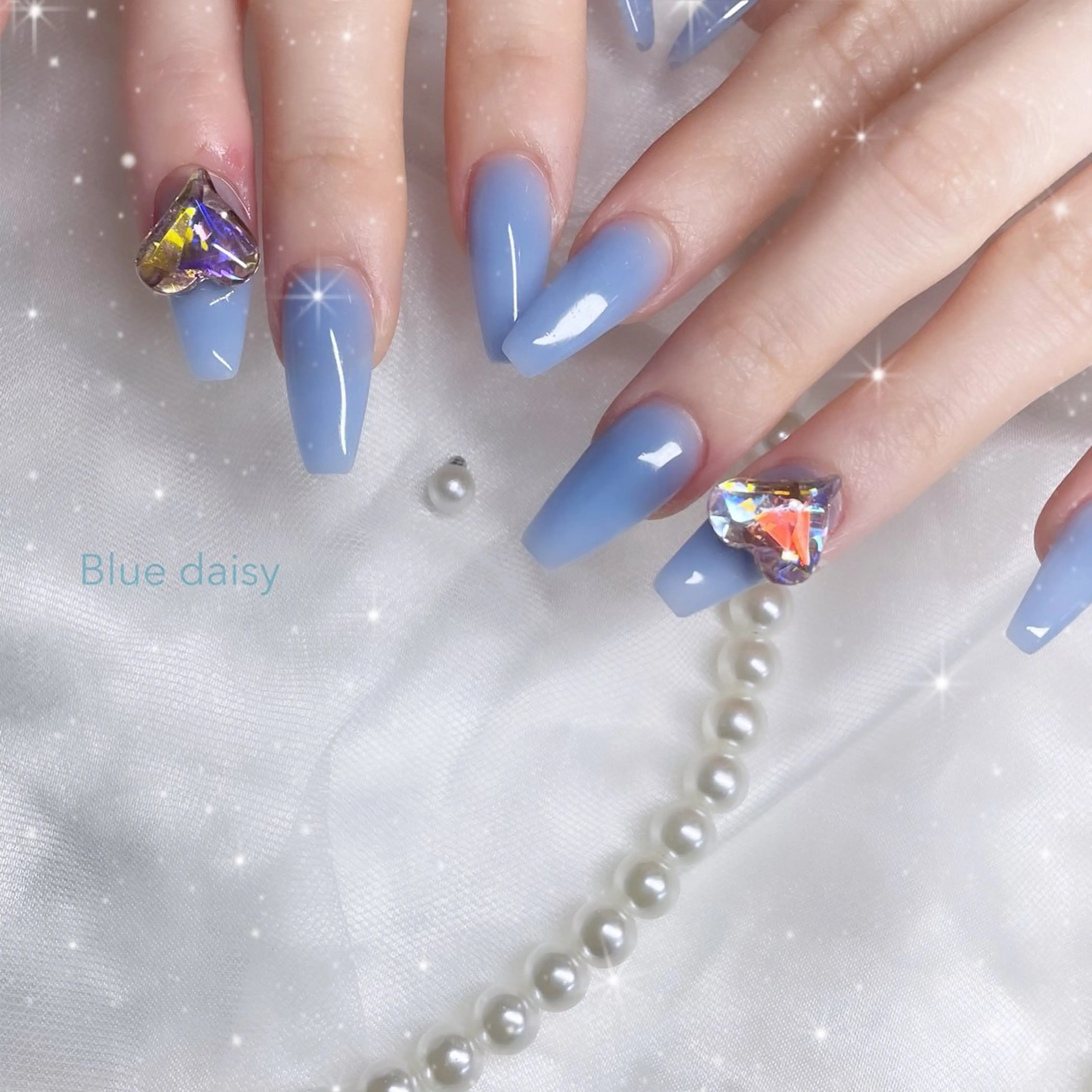 ネイル 水色 ワンカラーネイル ハンドネイル Blue daisy 栄本店のネイルデザイン