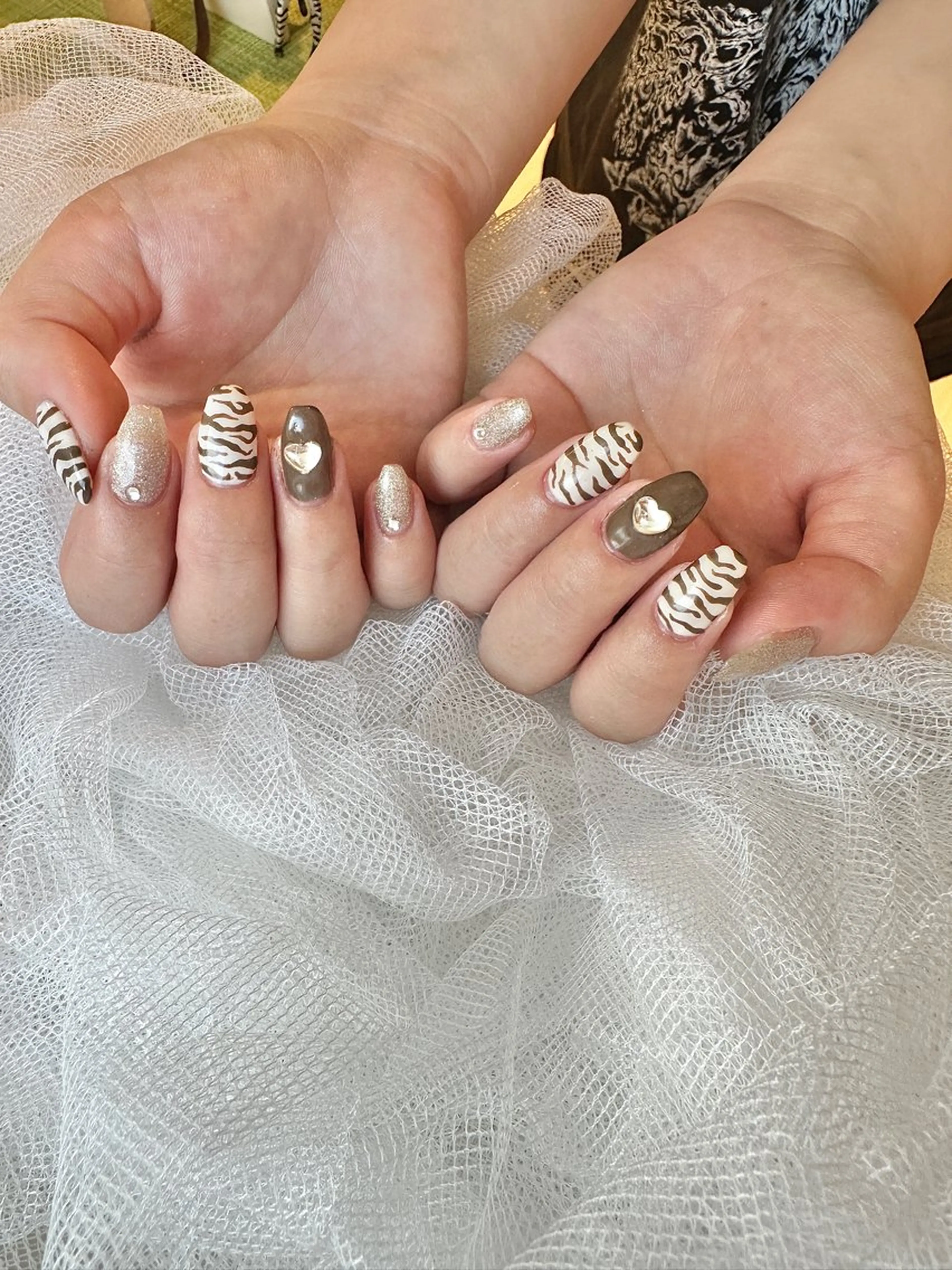 ネイル アニマル柄 ブラウン ハート キラキラネイル ハンドネイル private. nailsalonのネイルデザイン