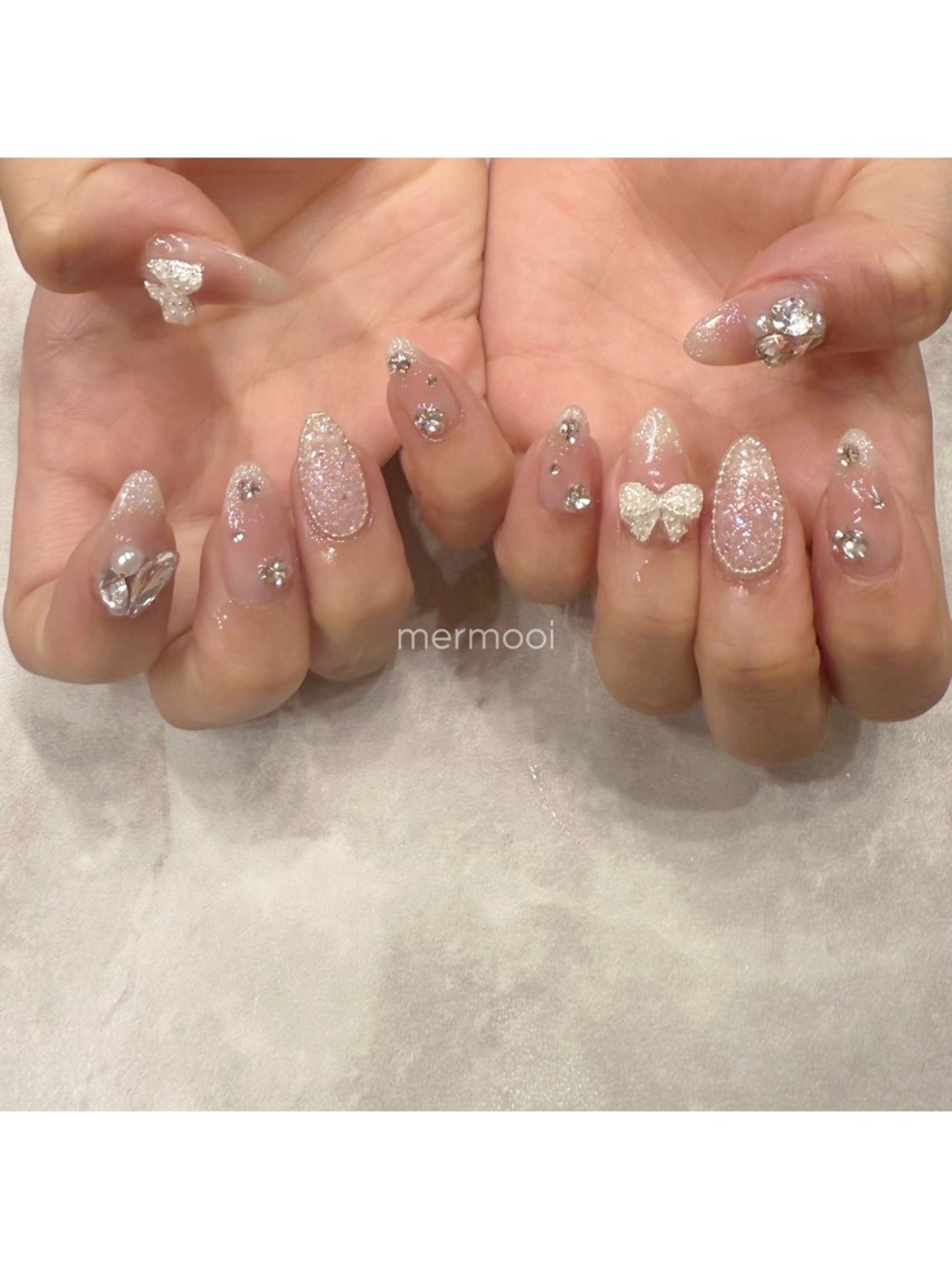 ネイル キラキラネイル 韓国ネイル ラメ(グリッター) ロングネイル リボン ハンドネイル melumooi nailのネイルデザイン