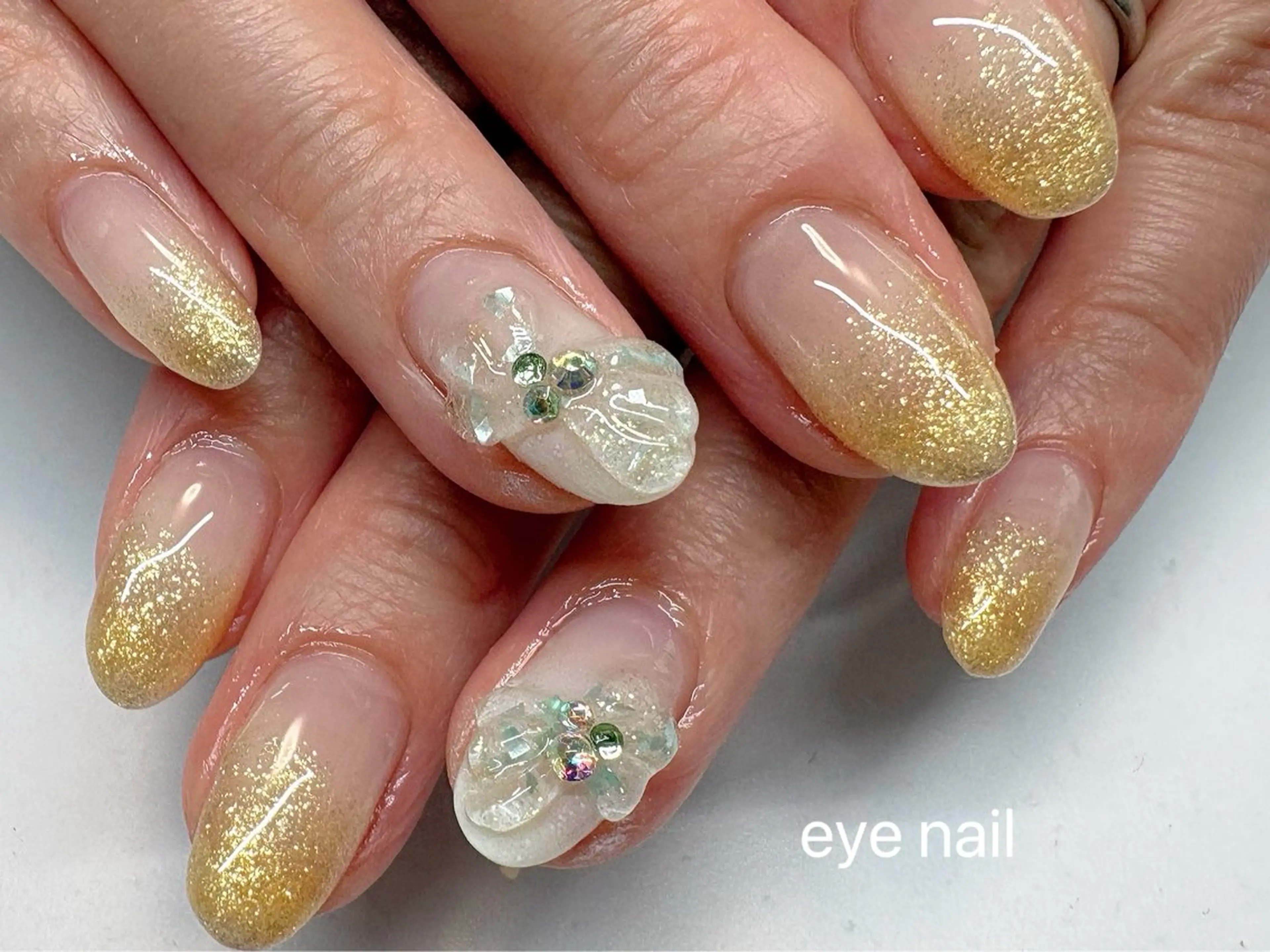 ネイル クリアネイル グラデーション ラメ(グリッター) ラメグラデーション リボン ハンドネイル Eye nailのネイルデザイン