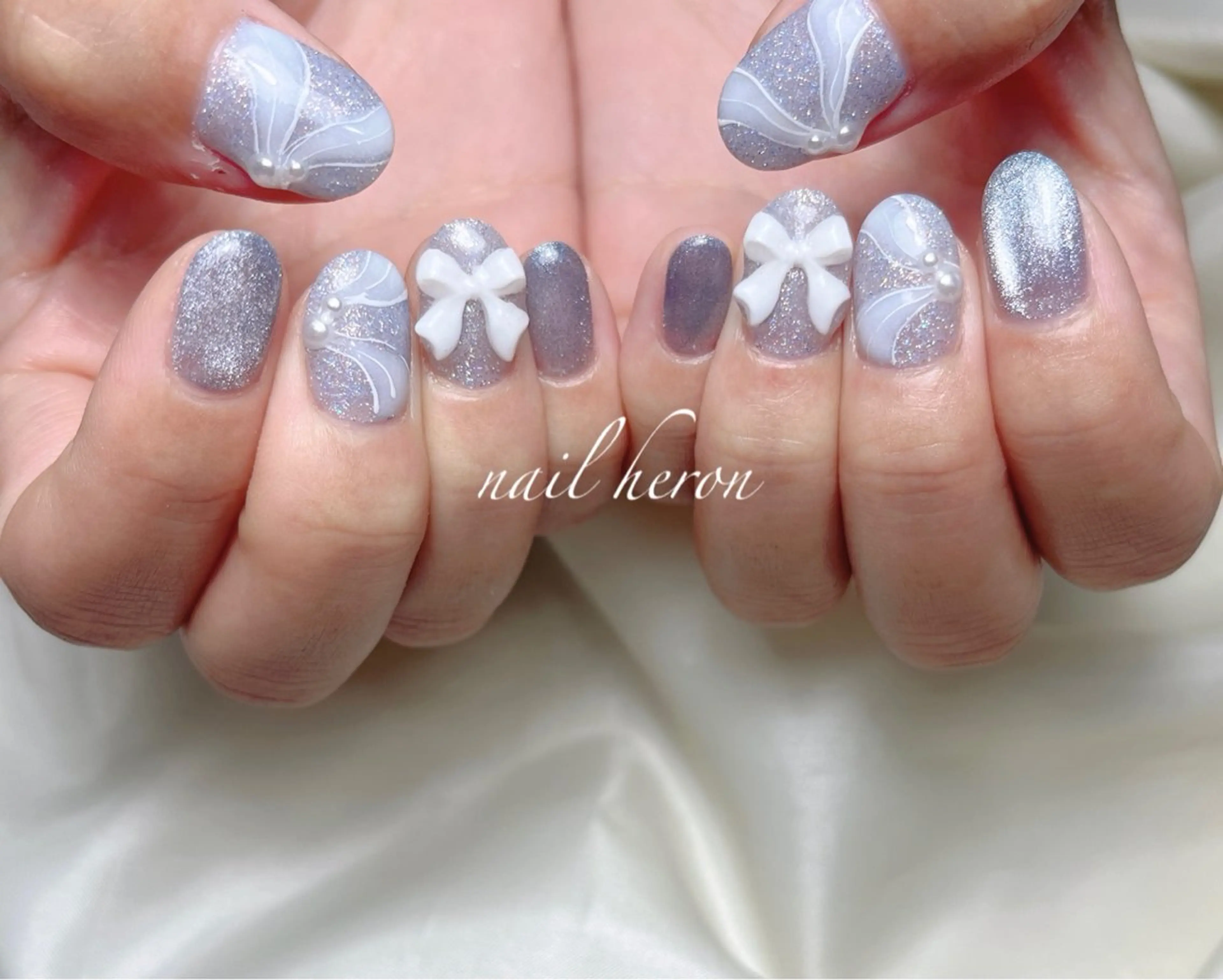 ネイル リボン ハンドネイル saki_ nail heronのネイルデザイン