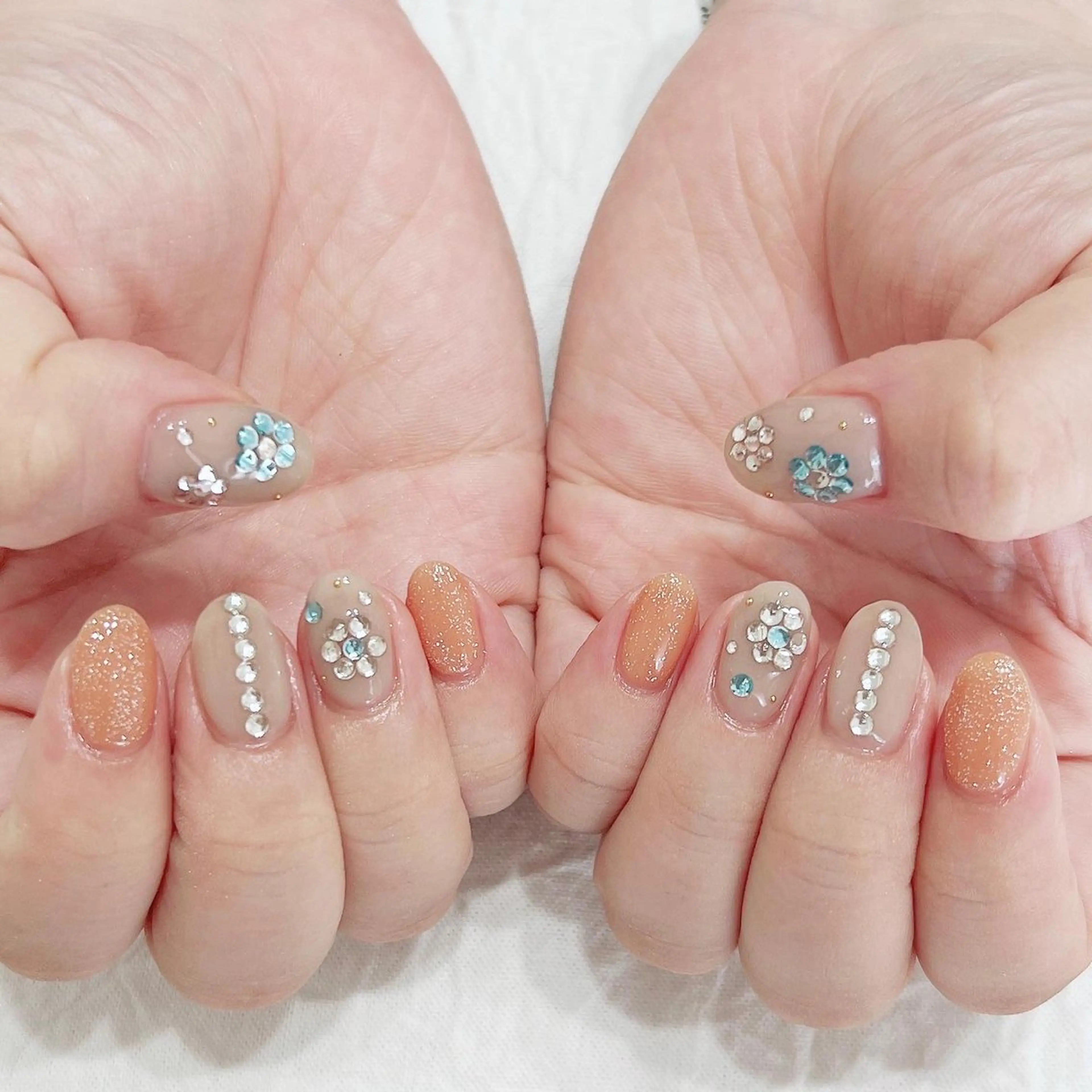 ネイル 水色 オレンジ ハンドネイル peaberry nailのネイルデザイン