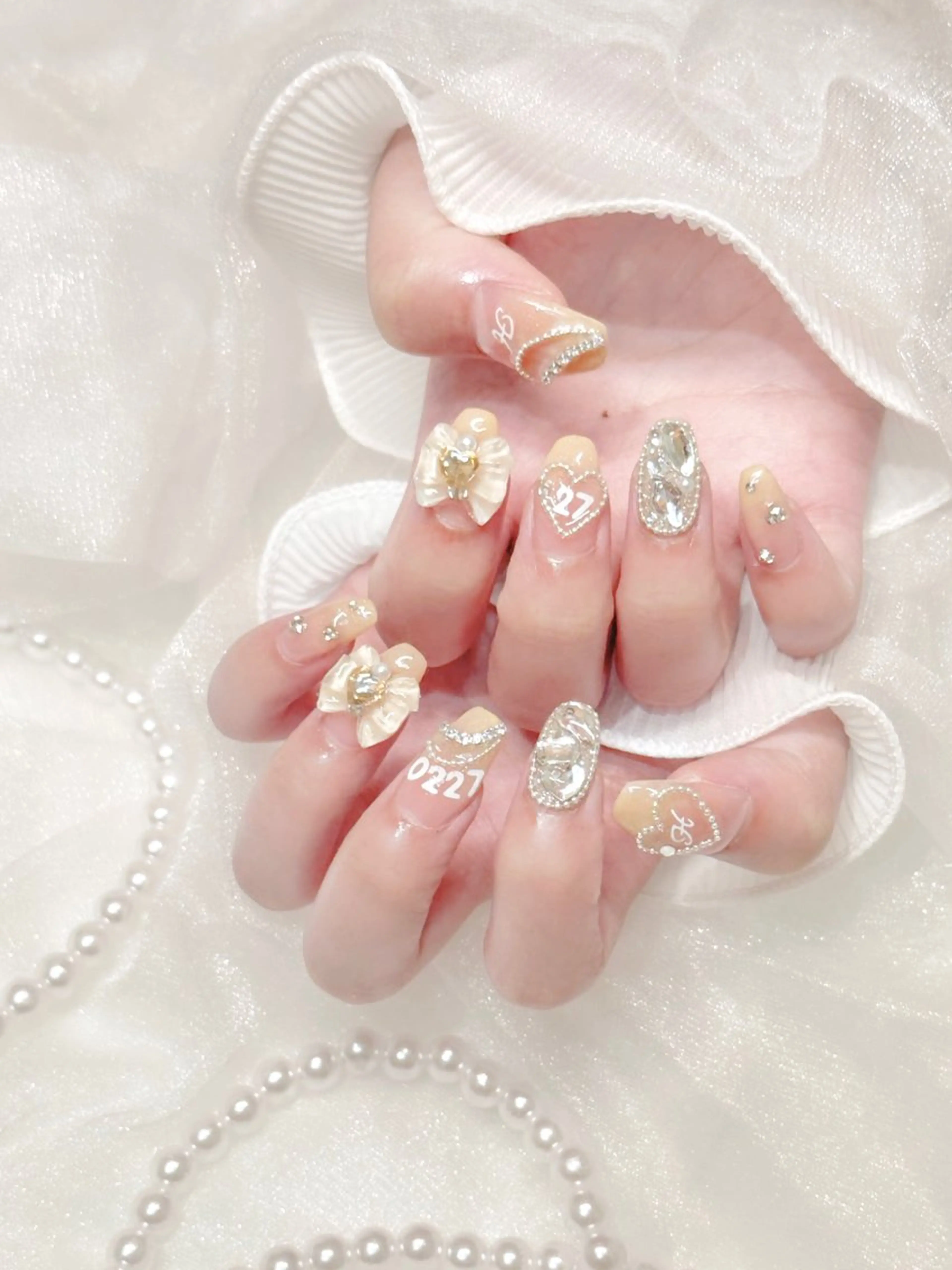 ネイル ガーリー キラキラネイル リボン nano nail☁ 久屋大通💫のネイルデザイン