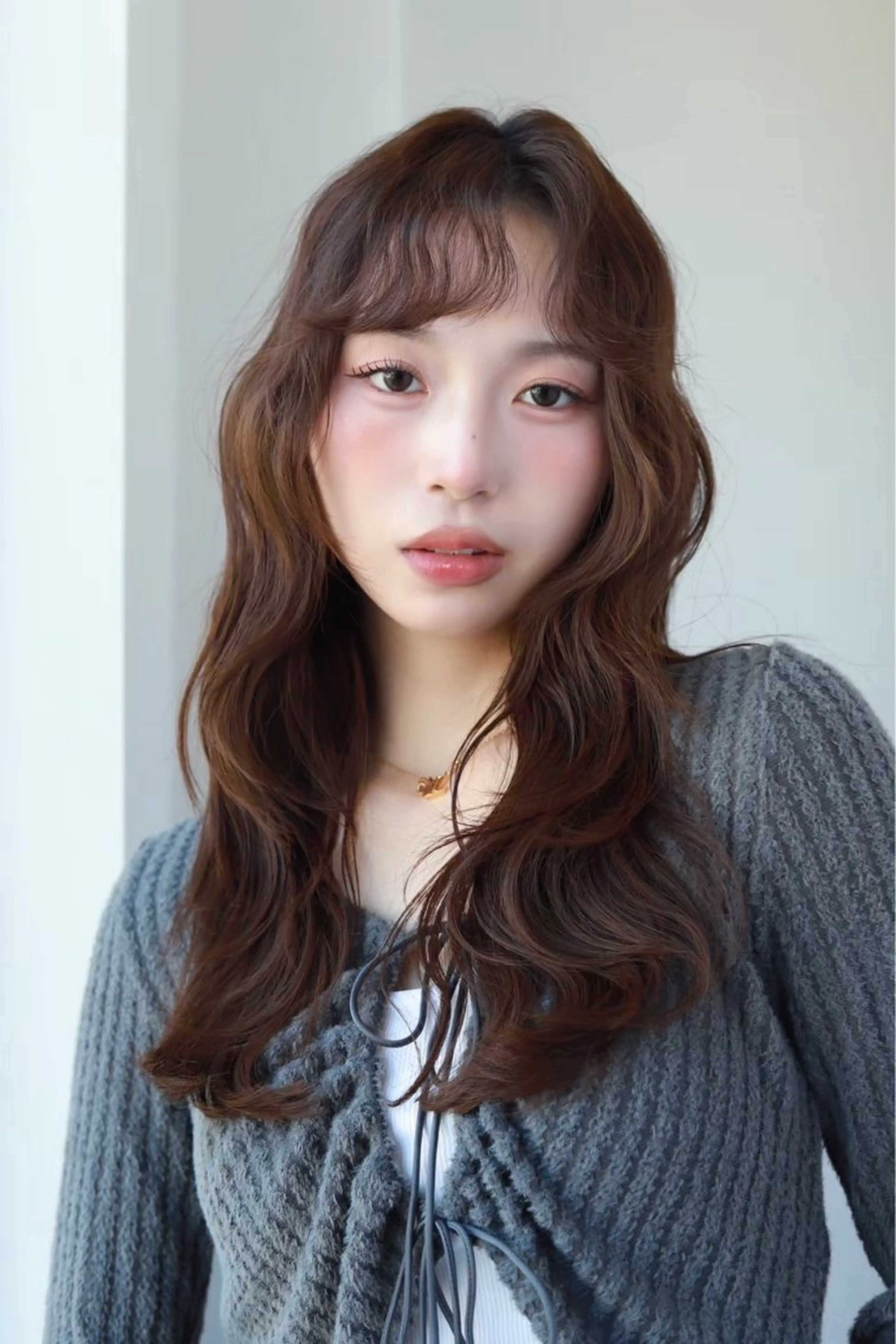 似合わせカット+スタイリングしやすいパーマ[ボブレイヤーカット/顔周り]の写真