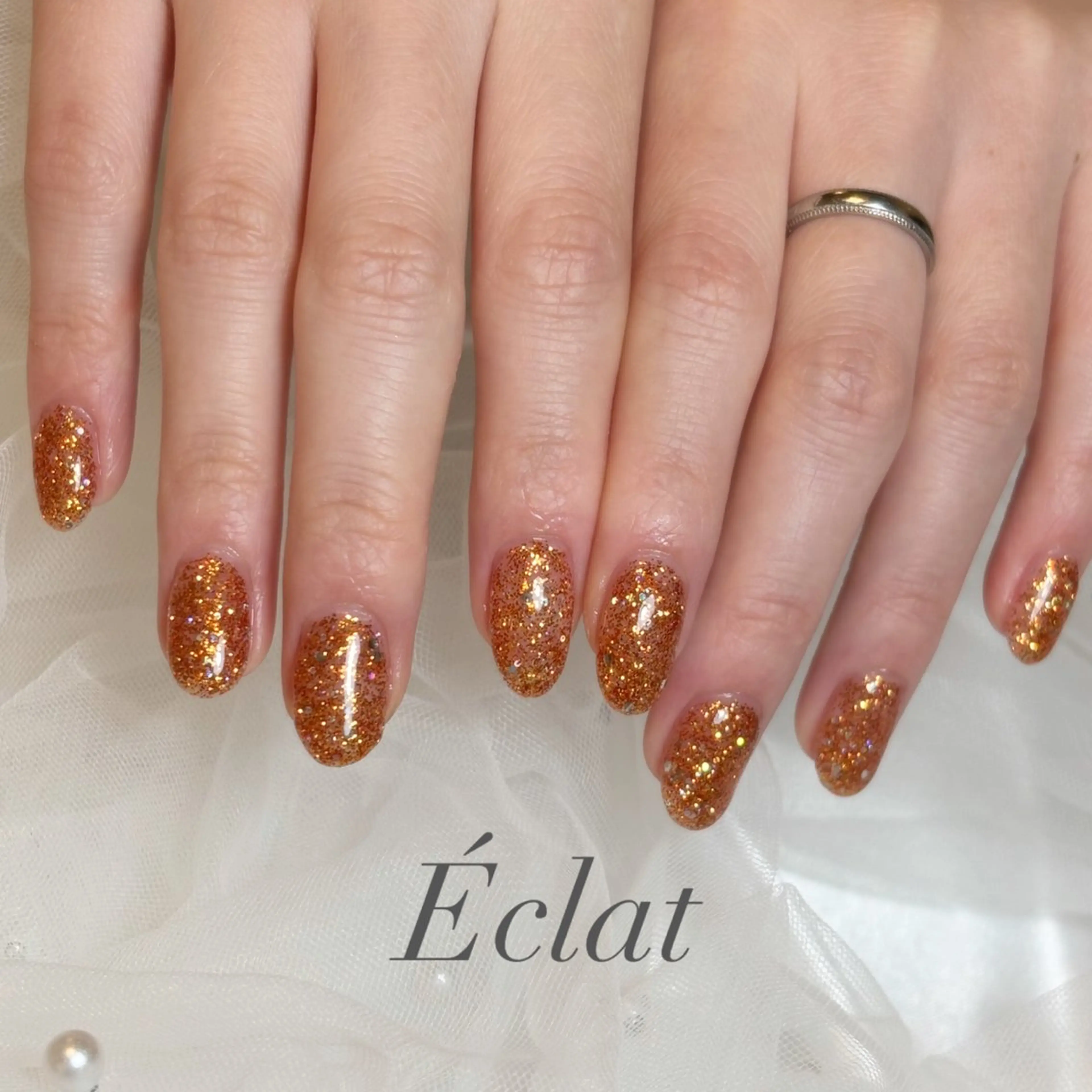 ネイル ラメ(グリッター) ワンカラーネイル オレンジ ハンドネイル nail salon Éclatのネイルデザイン