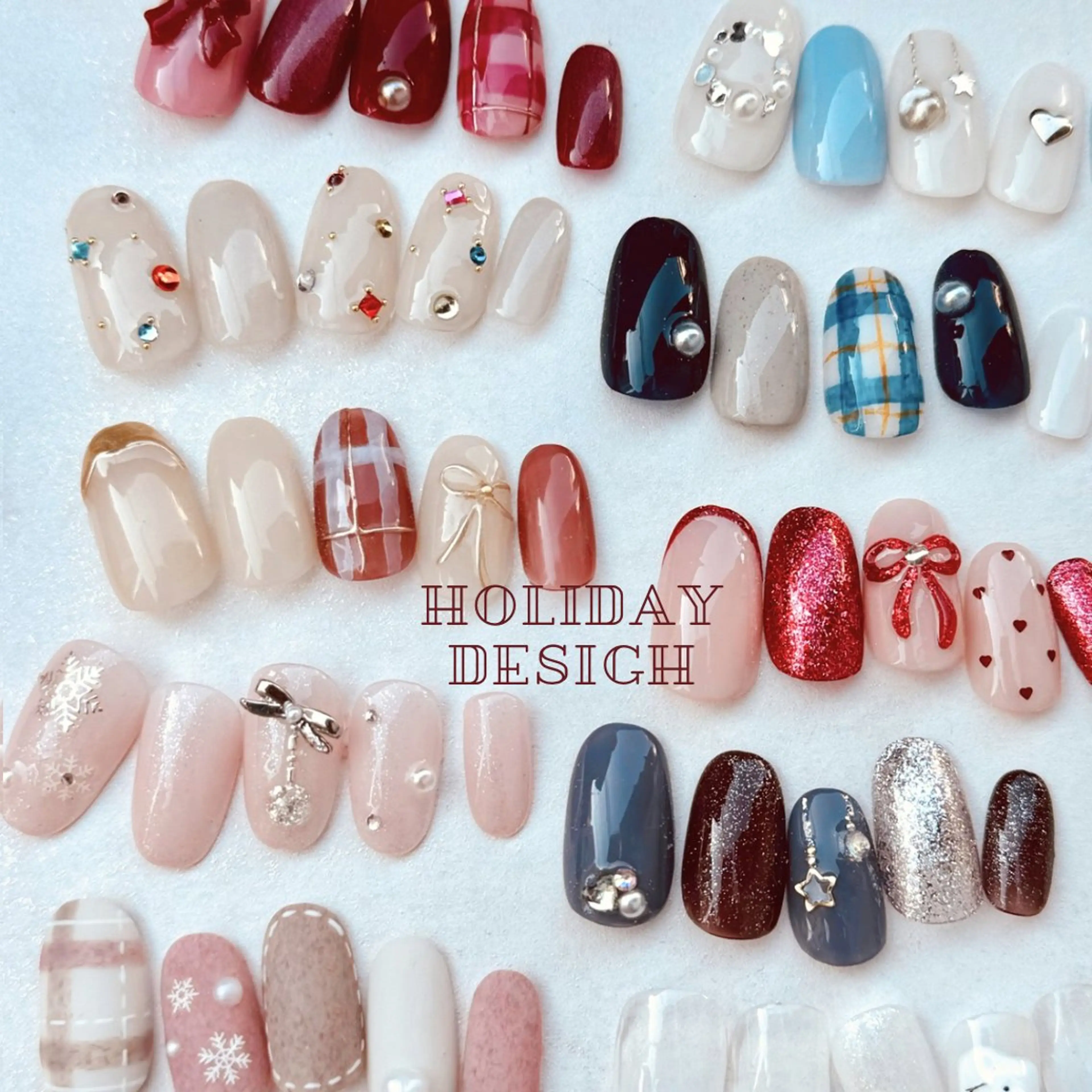 ネイル リボン ストーンネイル 冬ネイル クリスマス marusalo nailのネイルデザイン