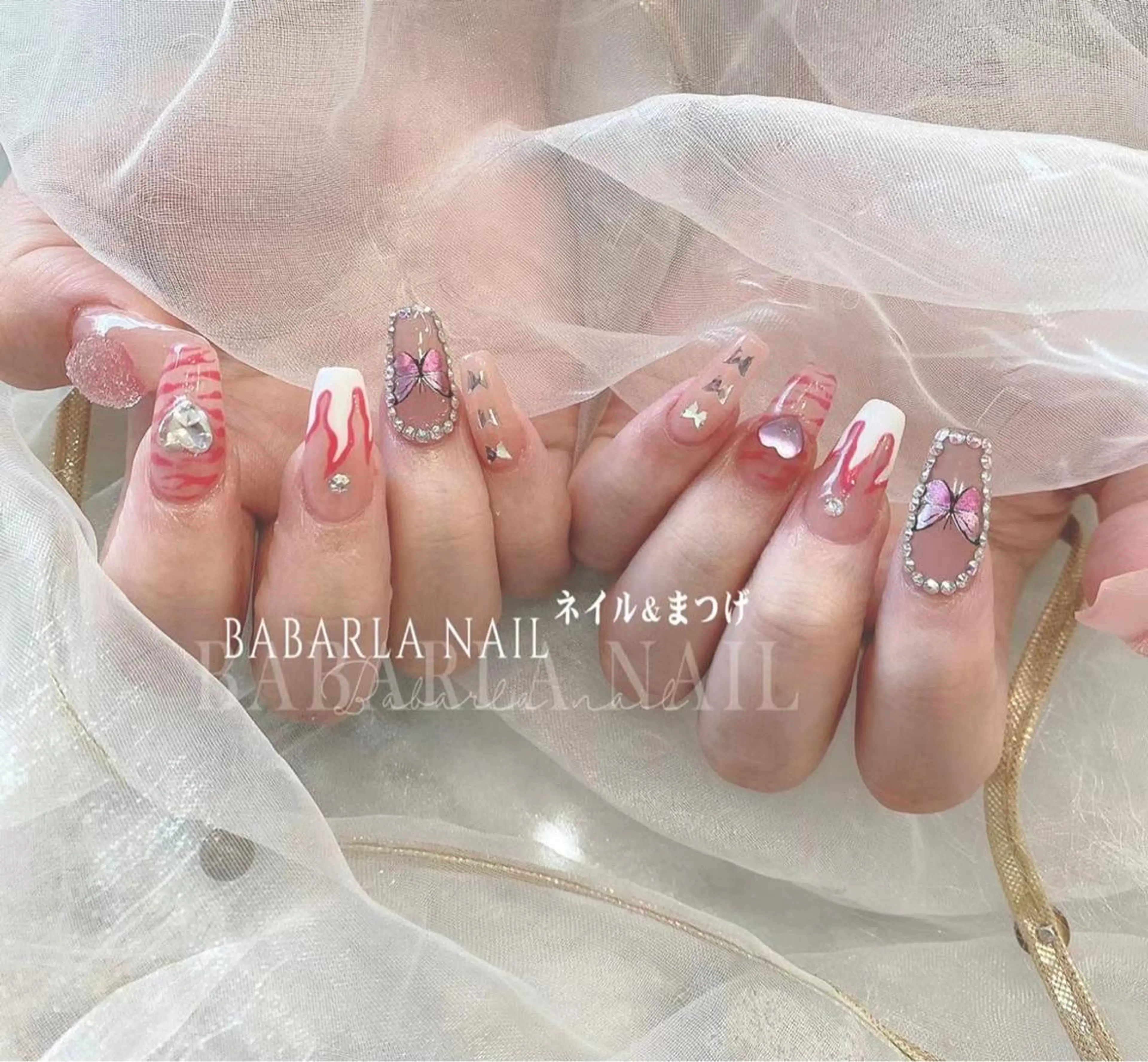 ネイル アニマル柄 赤色 ストーンネイル Babarla nailのネイルデザイン