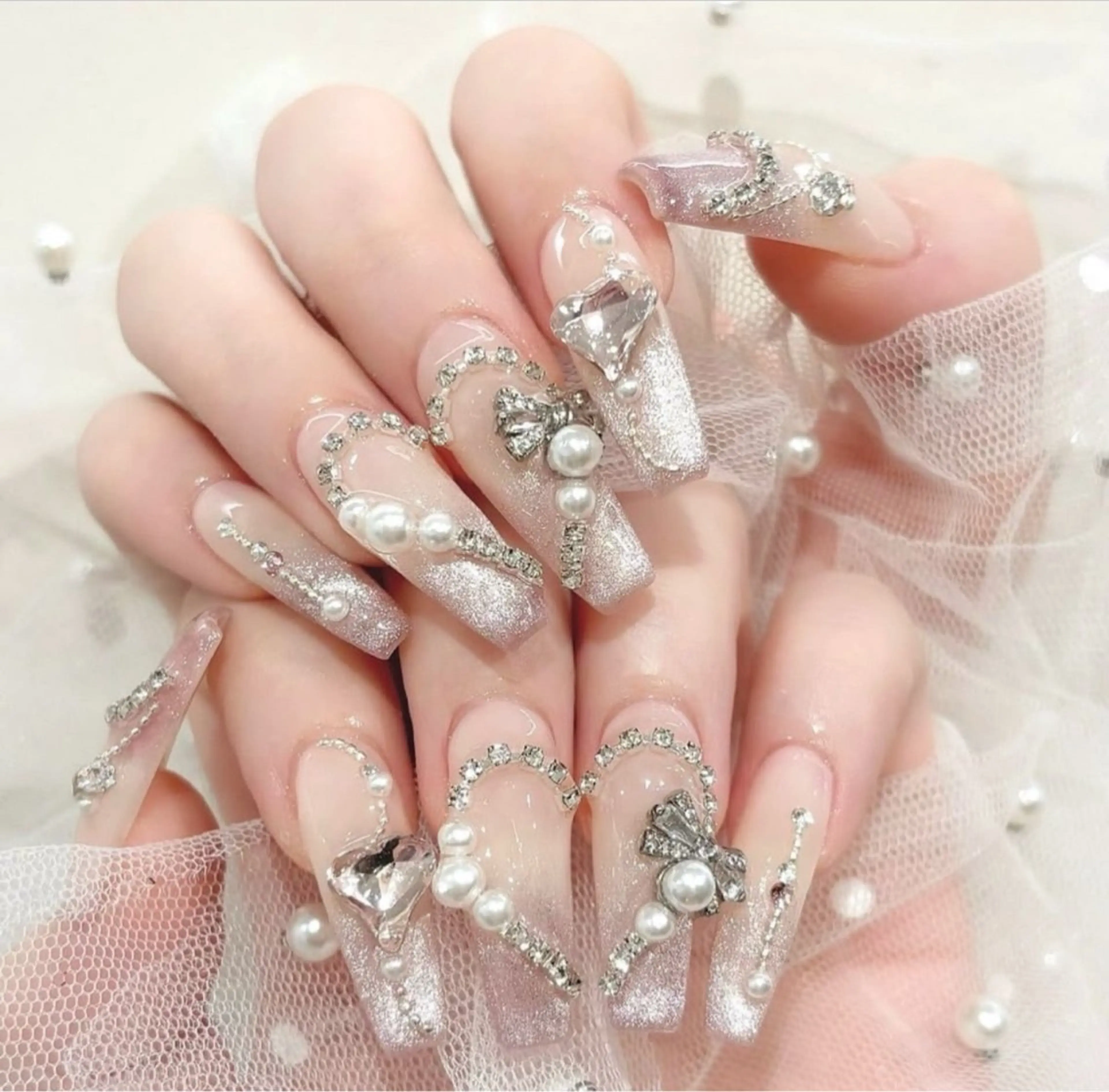 ネイル 成人式 ロングネイル マグネットネイル 大理石ネイル(マーブル) リボン ハンドネイル Amee Nail Salonのネイルデザイン