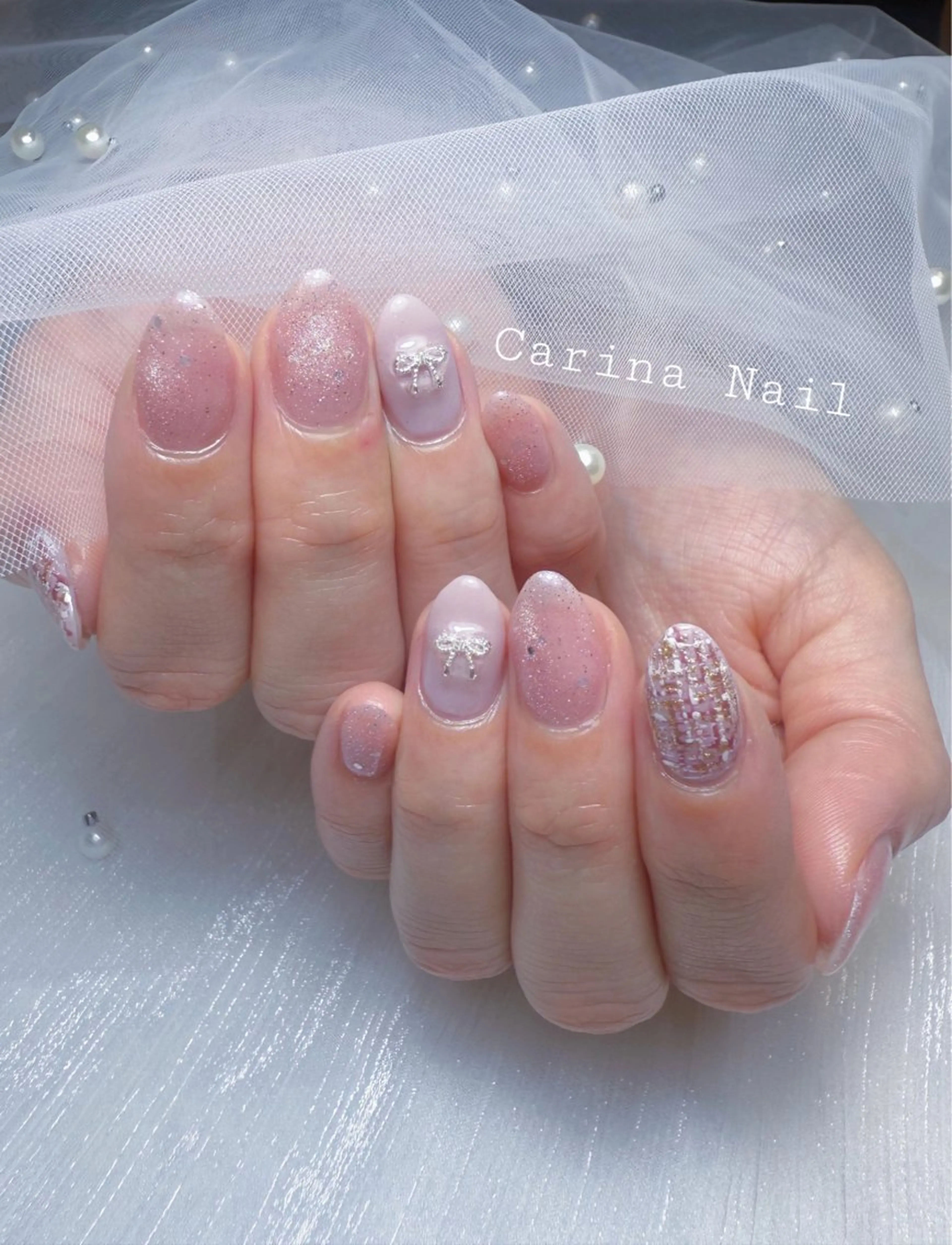 ネイル ラメ(グリッター) ピンク リボン Carina Nail所属・Carina Nailのネイルデザイン