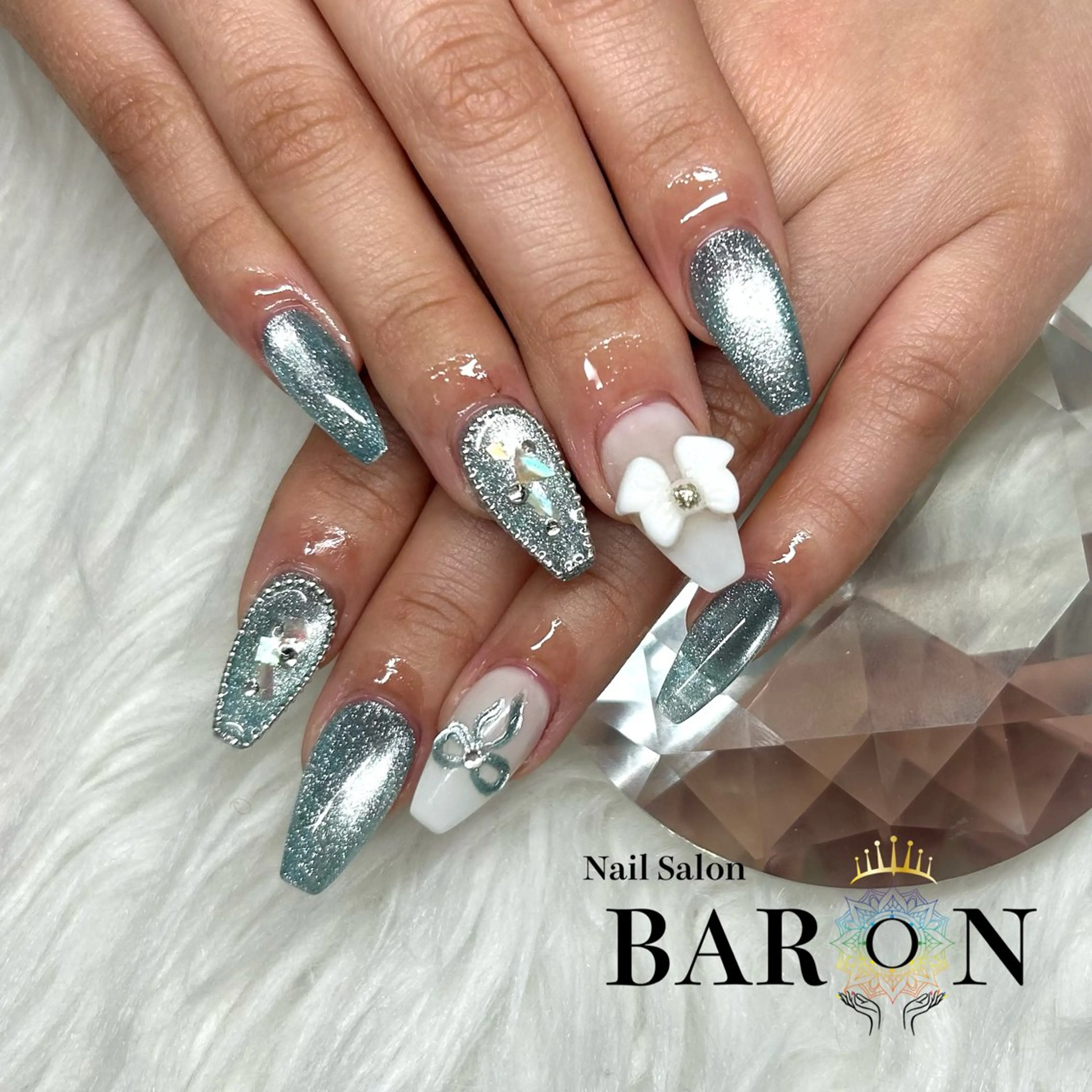 ネイル 水色 リボン ♛︎BARON♛︎ SUMIRE.のネイルデザイン