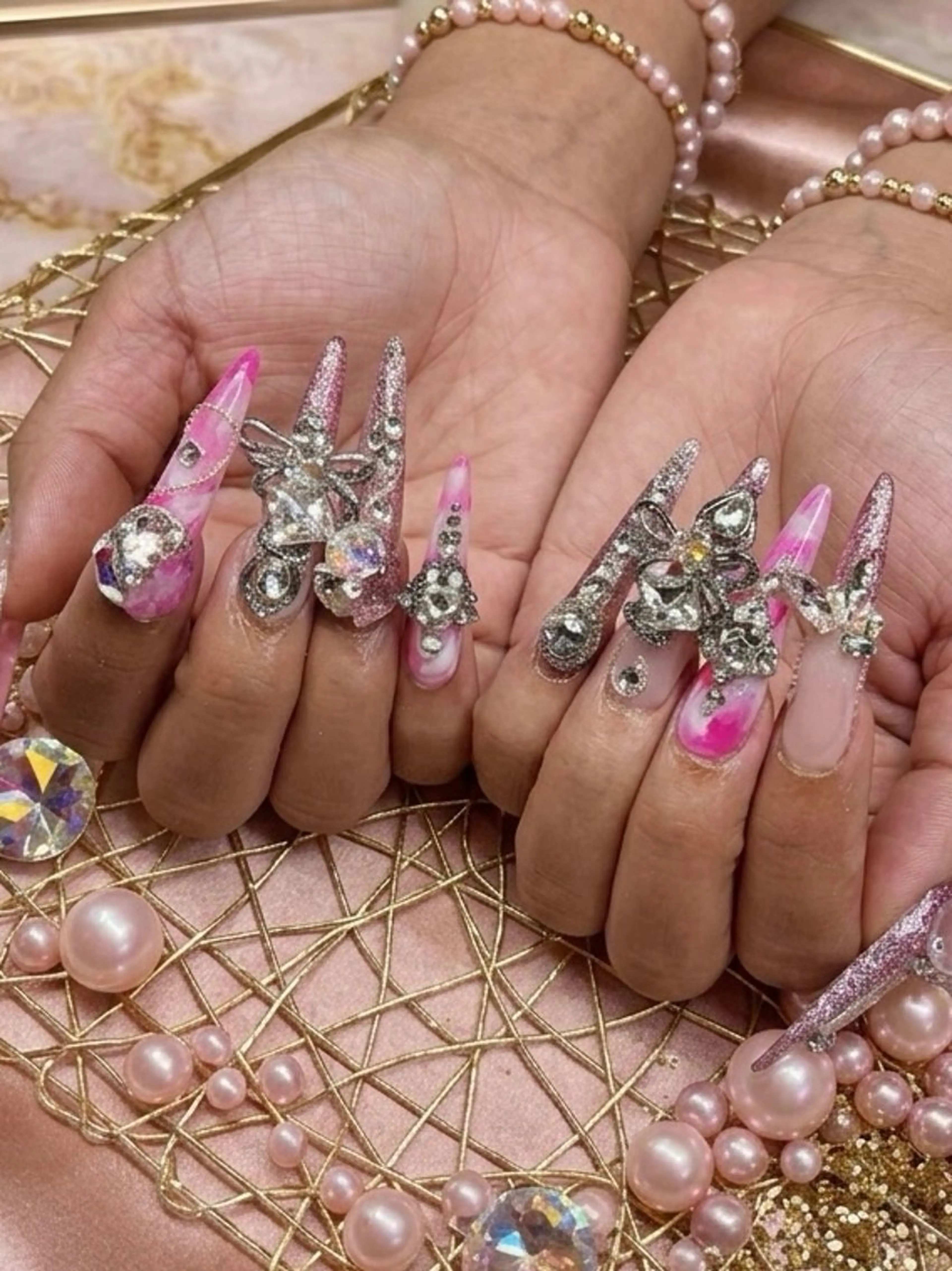 ネイル ロングネイル 大理石ネイル(マーブル) ピンク リボン ストーンネイル ハンドネイル TUNEHA堂 (チュネハドウ)のネイルデザイン