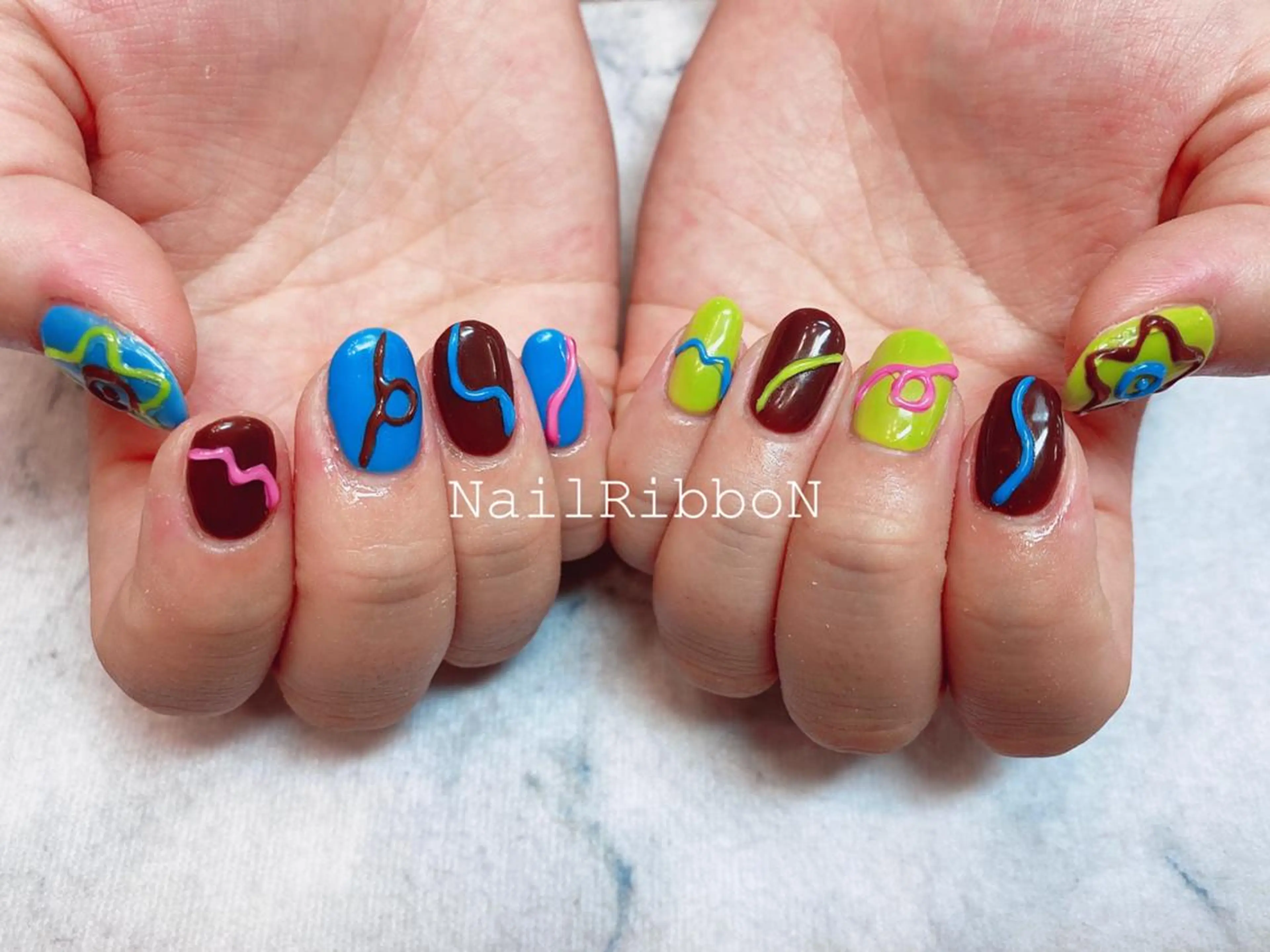 ネイル ネイルリボン 受付スタッフのネイルデザイン