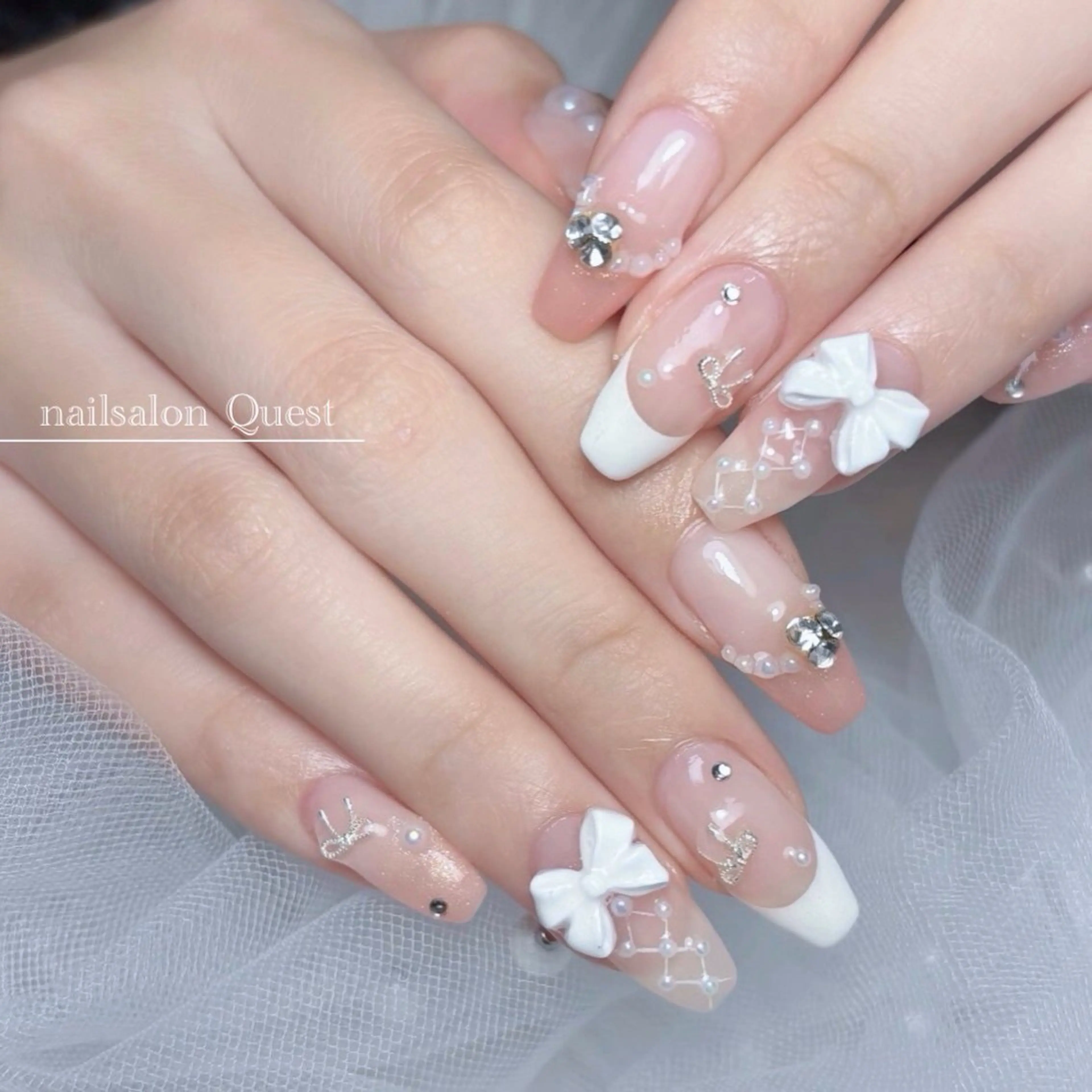 ネイル ガーリー キラキラネイル ピンク リボン 春ネイル ハンドネイル nailsalon Questのネイルデザイン