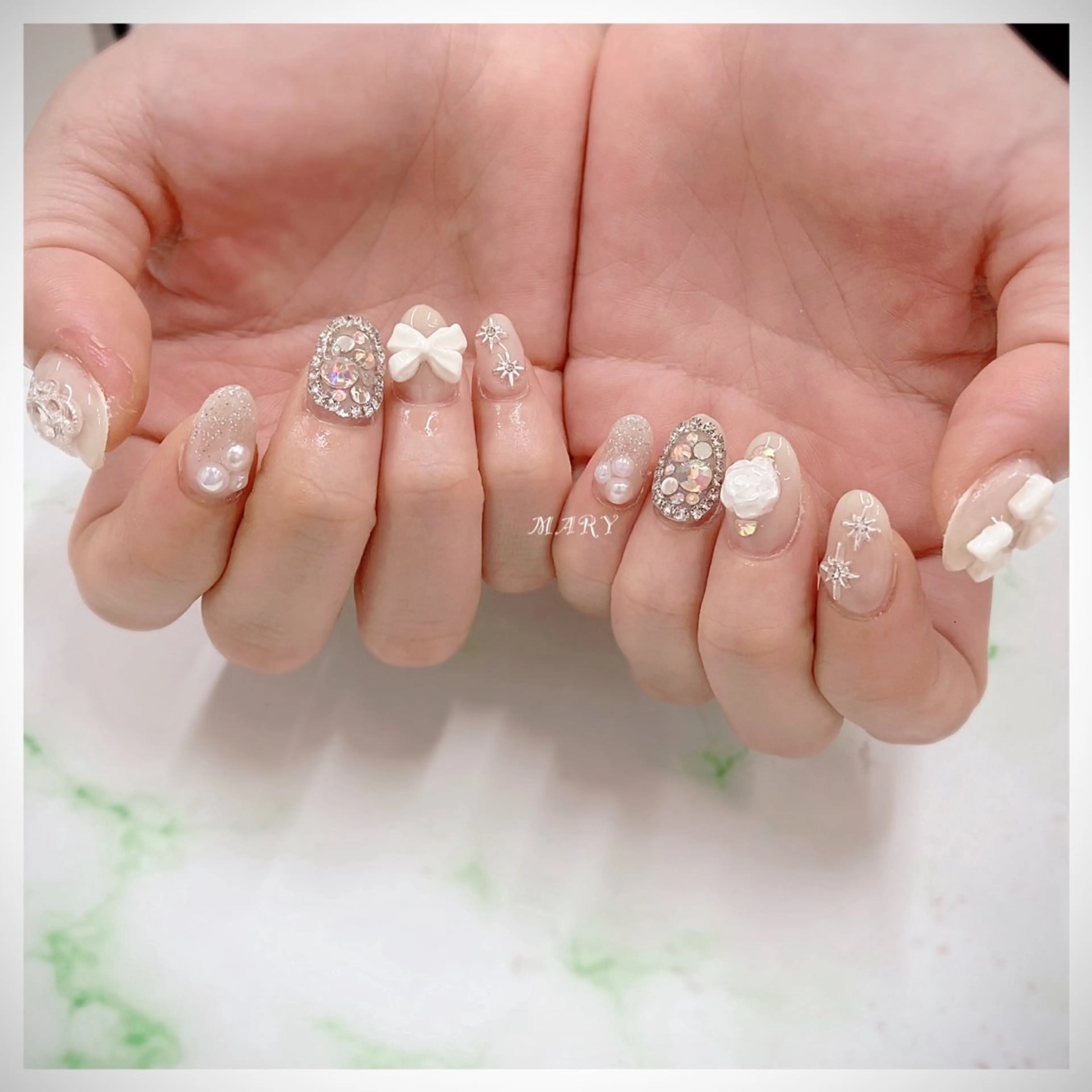 ネイル キラキラネイル ニュアンスネイル ワンカラーネイル リボン ハンドネイル Mary nail所属・Mary nail .narumiのネイルデザイン