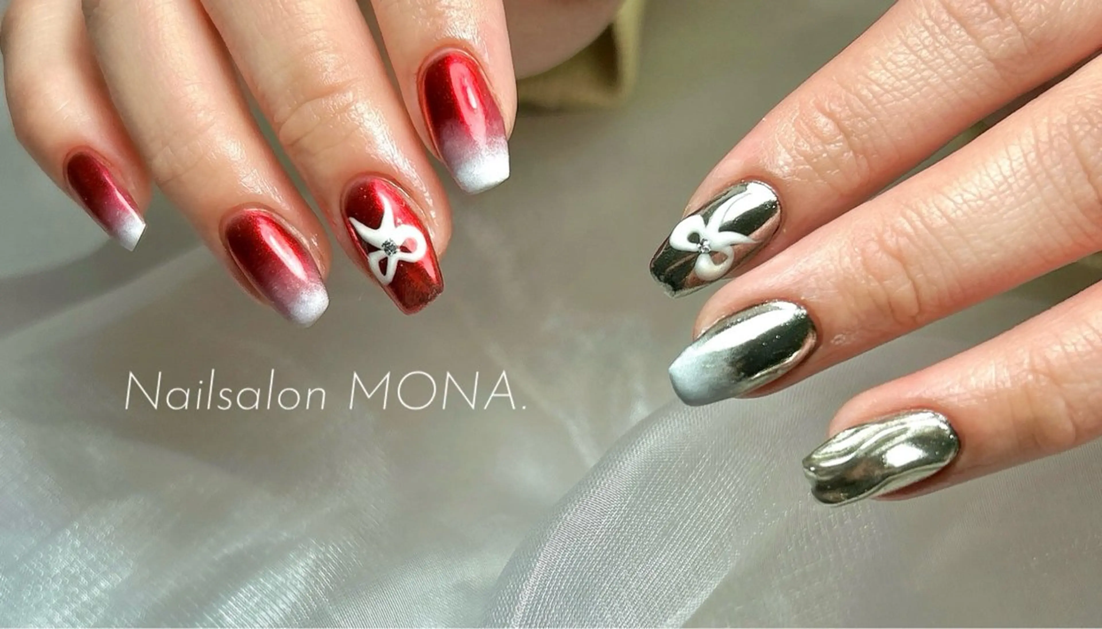 ネイル ミラーネイル 赤色 リボン シルバー ハンドネイル Nailsalon MONA.のネイルデザイン