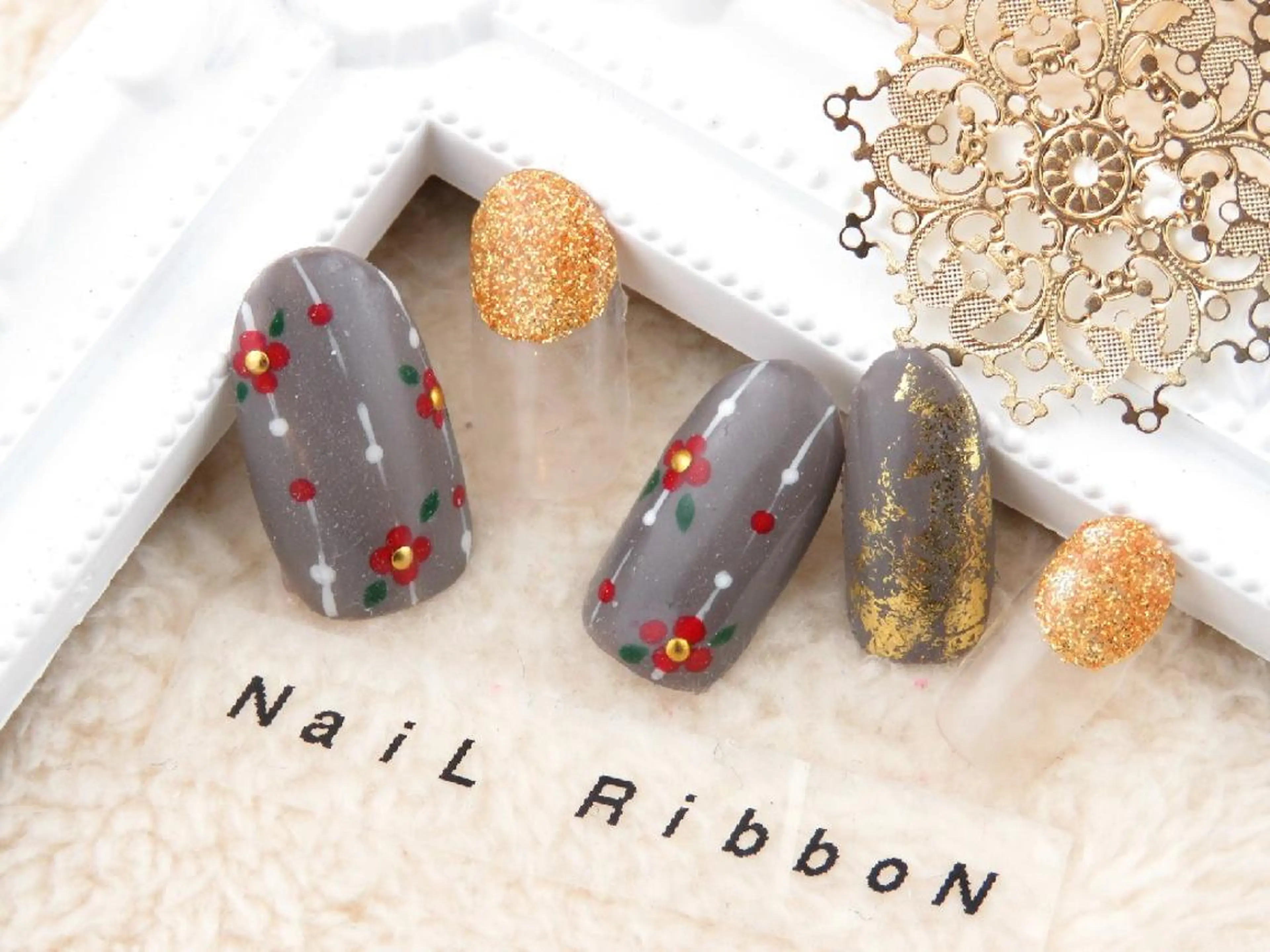 ネイル ネイルリボン 受付スタッフのネイルデザイン