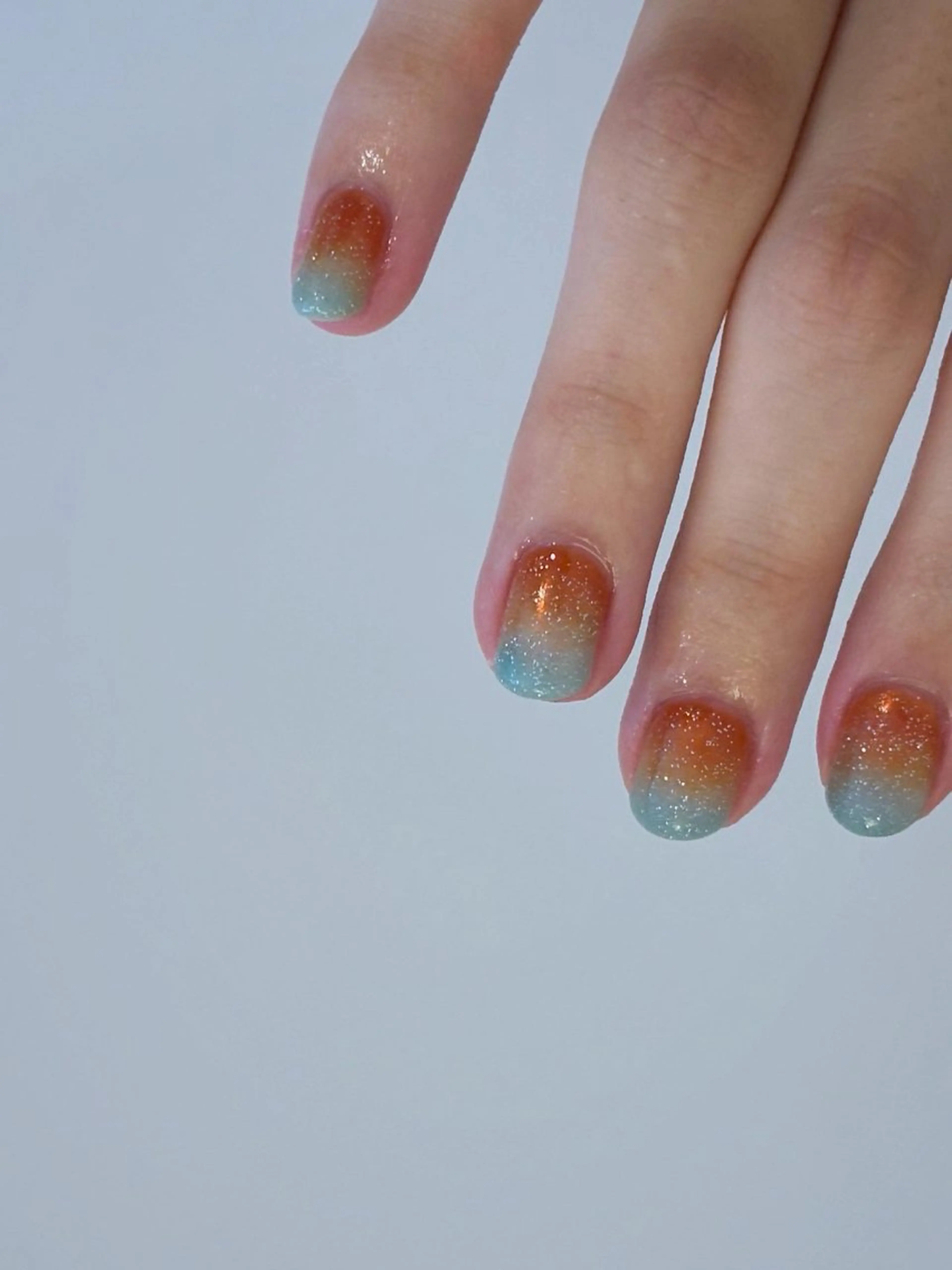 ネイル 水色 オレンジ ハンドネイル Elio 国泰寺のネイルデザイン