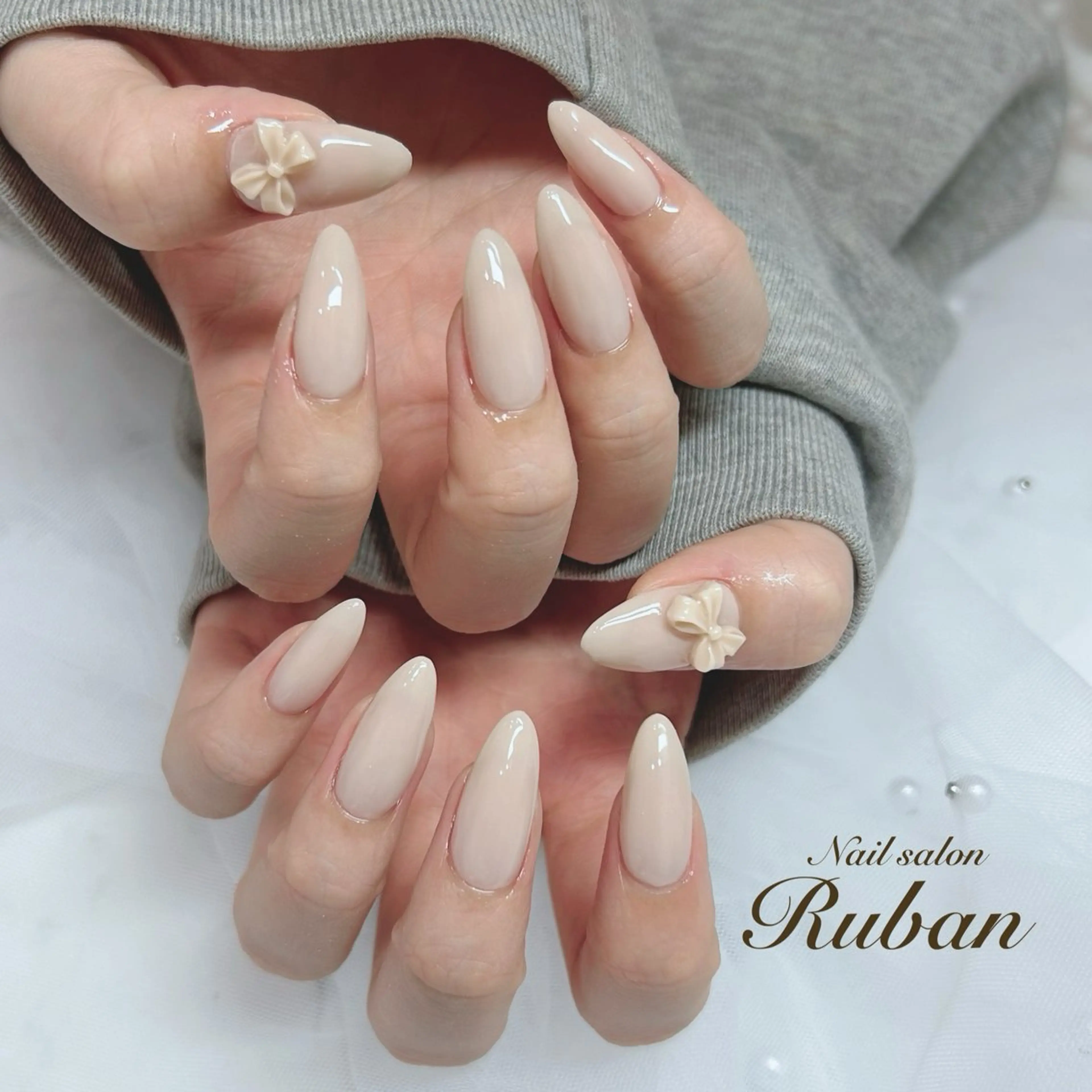 ネイル 長さ出し ロングネイル ワンカラーネイル リボン Nail salon Rubanのネイルデザイン