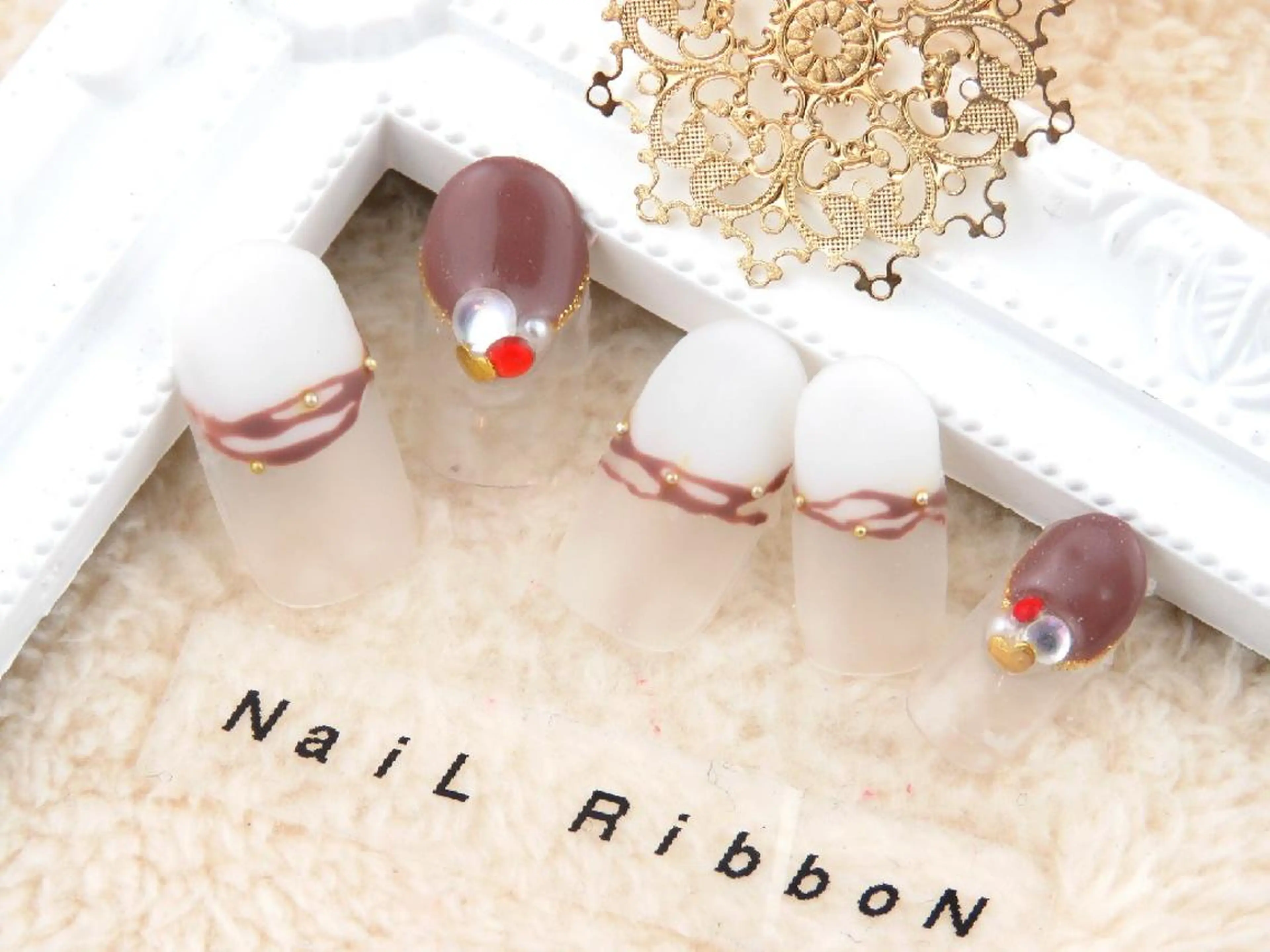 ネイル ネイルリボン 受付スタッフのネイルデザイン