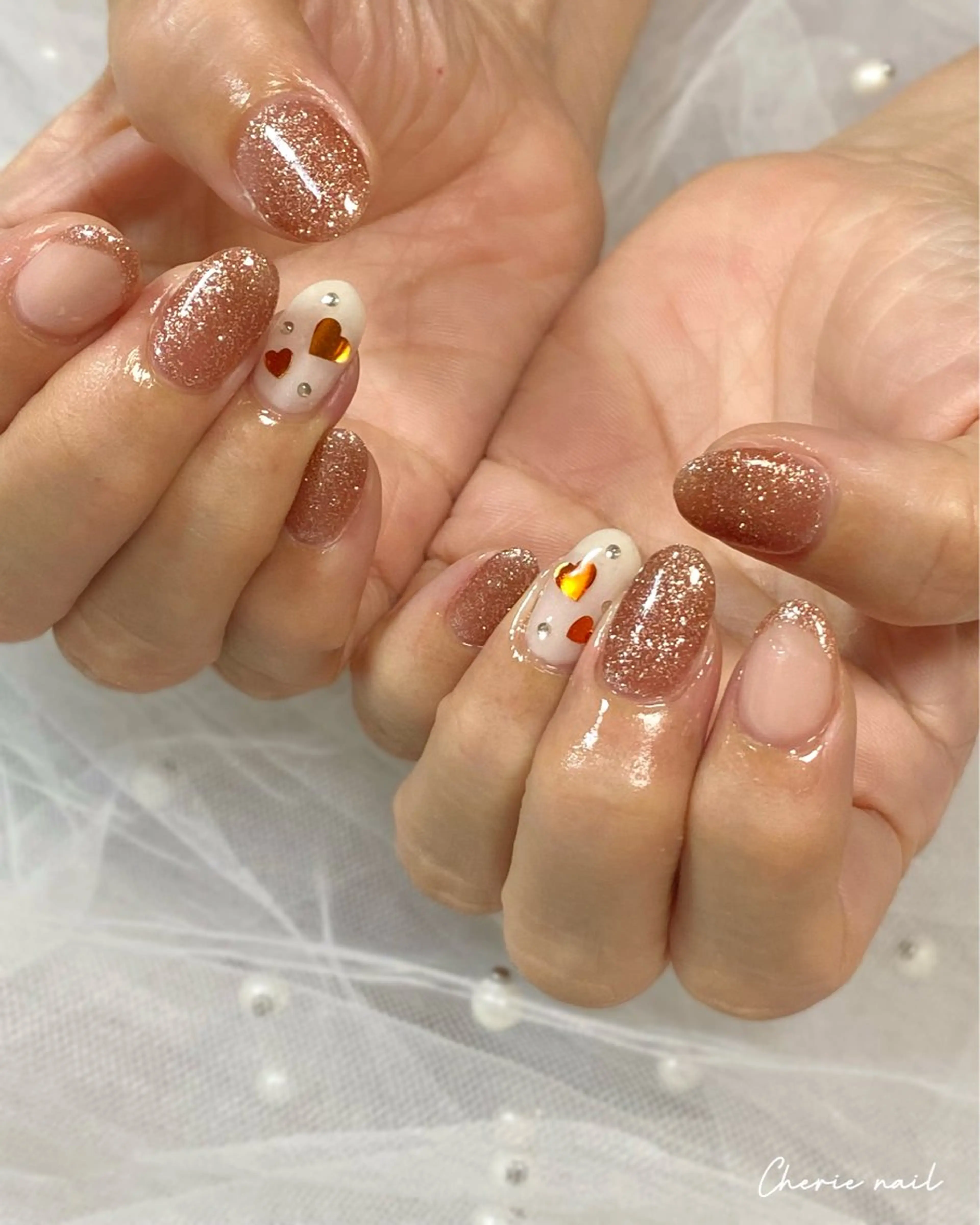 ネイル フラッシュネイル ジェルネイル ハート ラメ(グリッター) オレンジ ハンドネイル Cherienail yunaのネイルデザイン