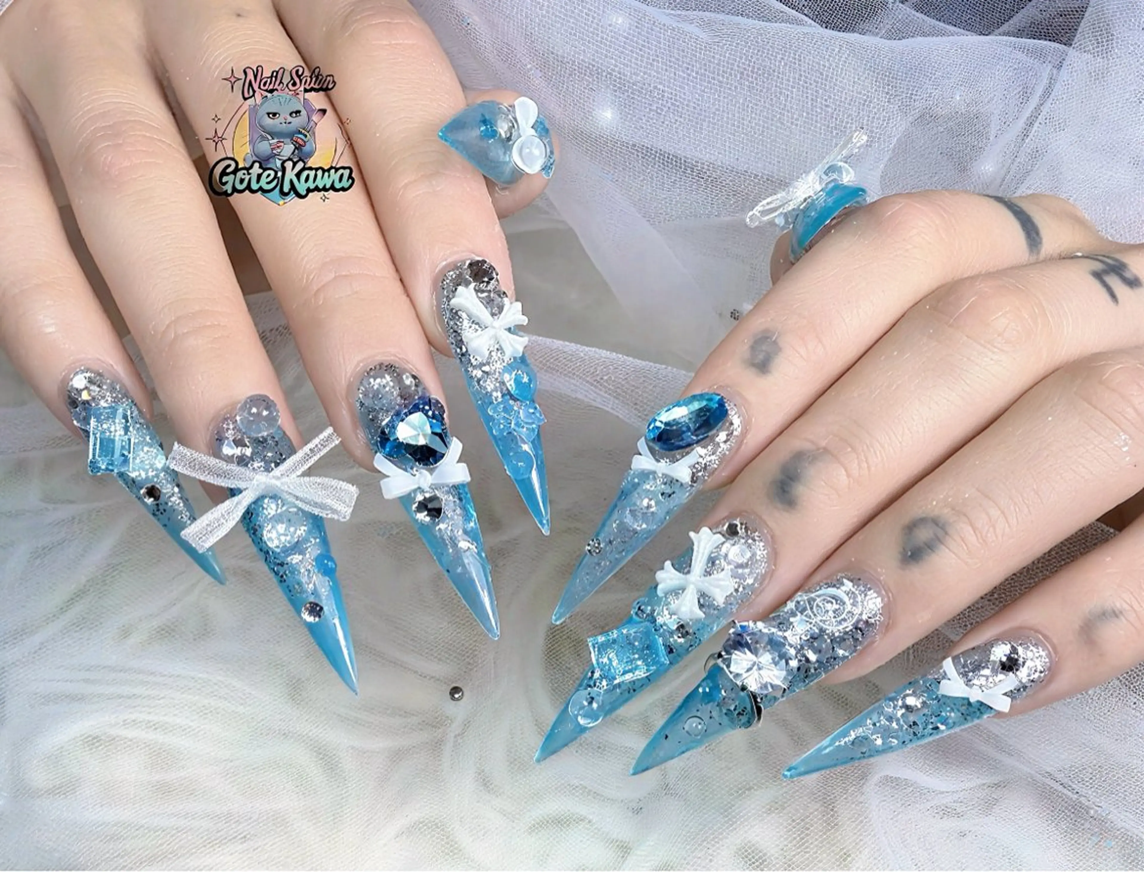ネイル クリアネイル リボン ストーンネイル 夏ネイル ハンドネイル ハンドケア Gote Kawa nail salonのネイルデザイン