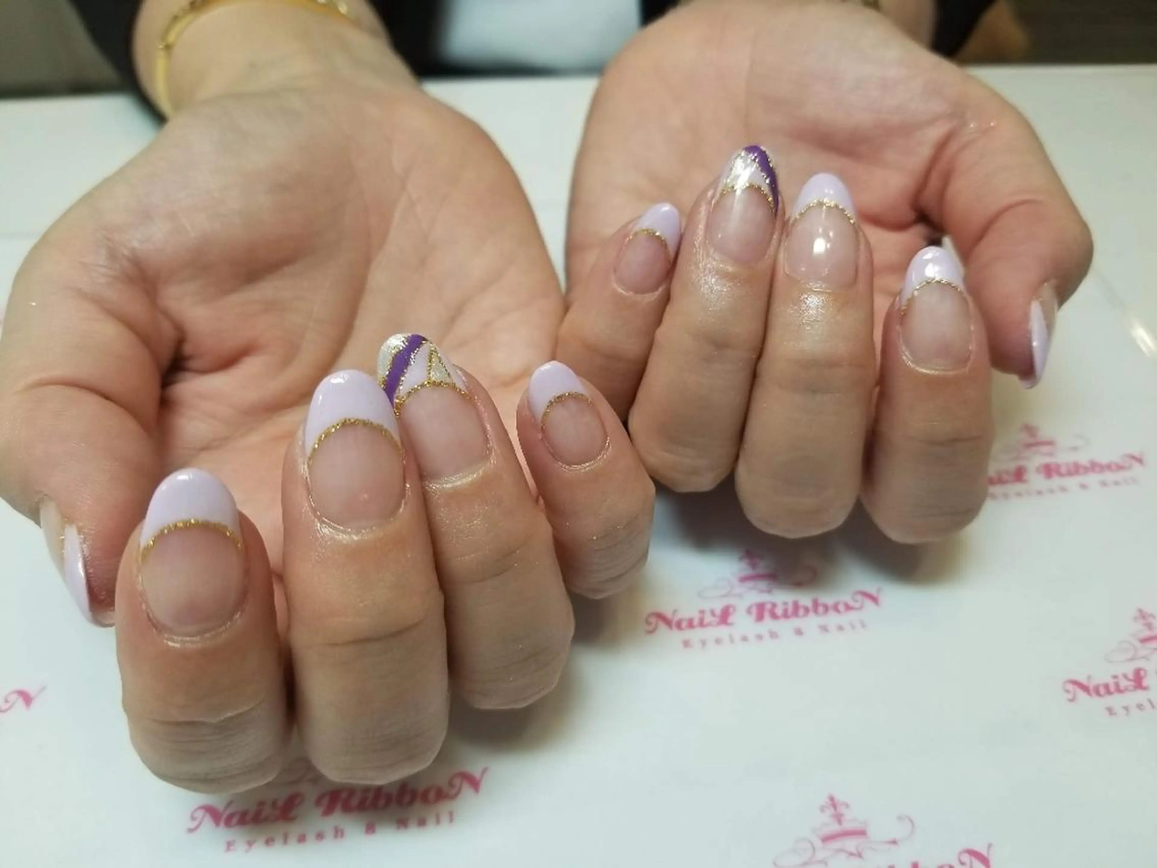 ネイル ネイルリボン 受付スタッフのネイルデザイン