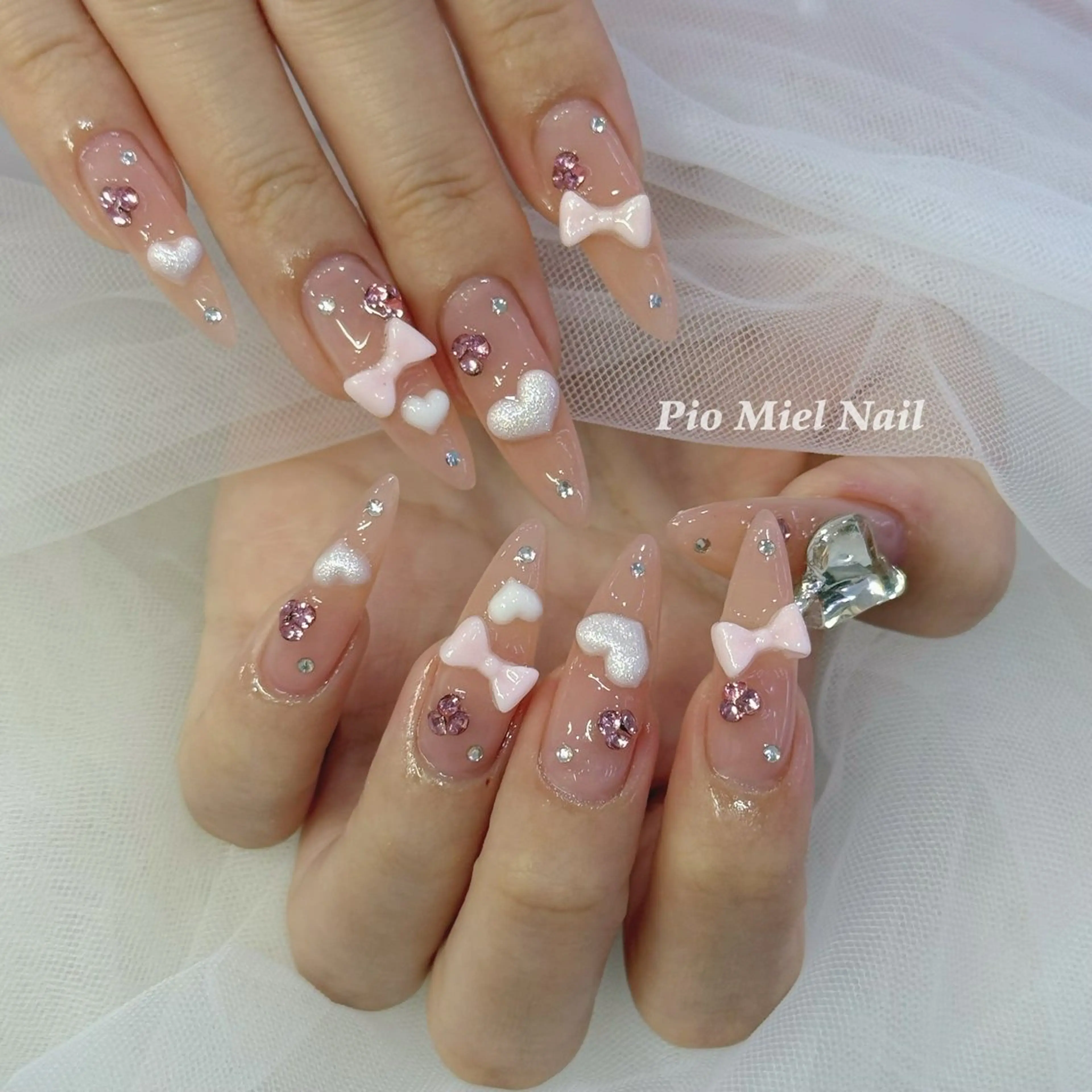 ネイル ガーリー ハート ピンク リボン ストーンネイル ハンドネイル HANA 長さだしのネイルデザイン