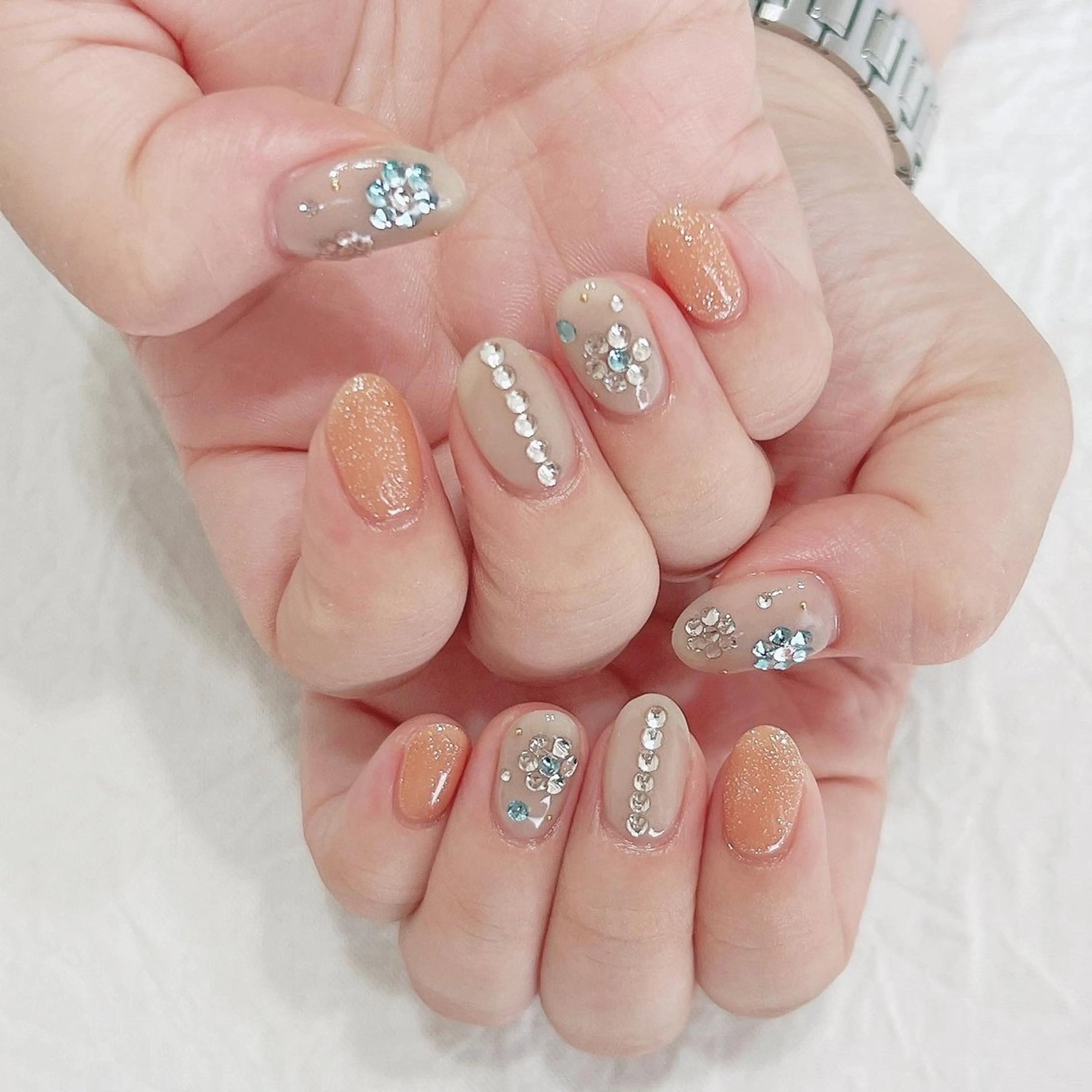 ネイル キラキラネイル オレンジ ストーンネイル ハンドネイル peaberry nailのネイルデザイン