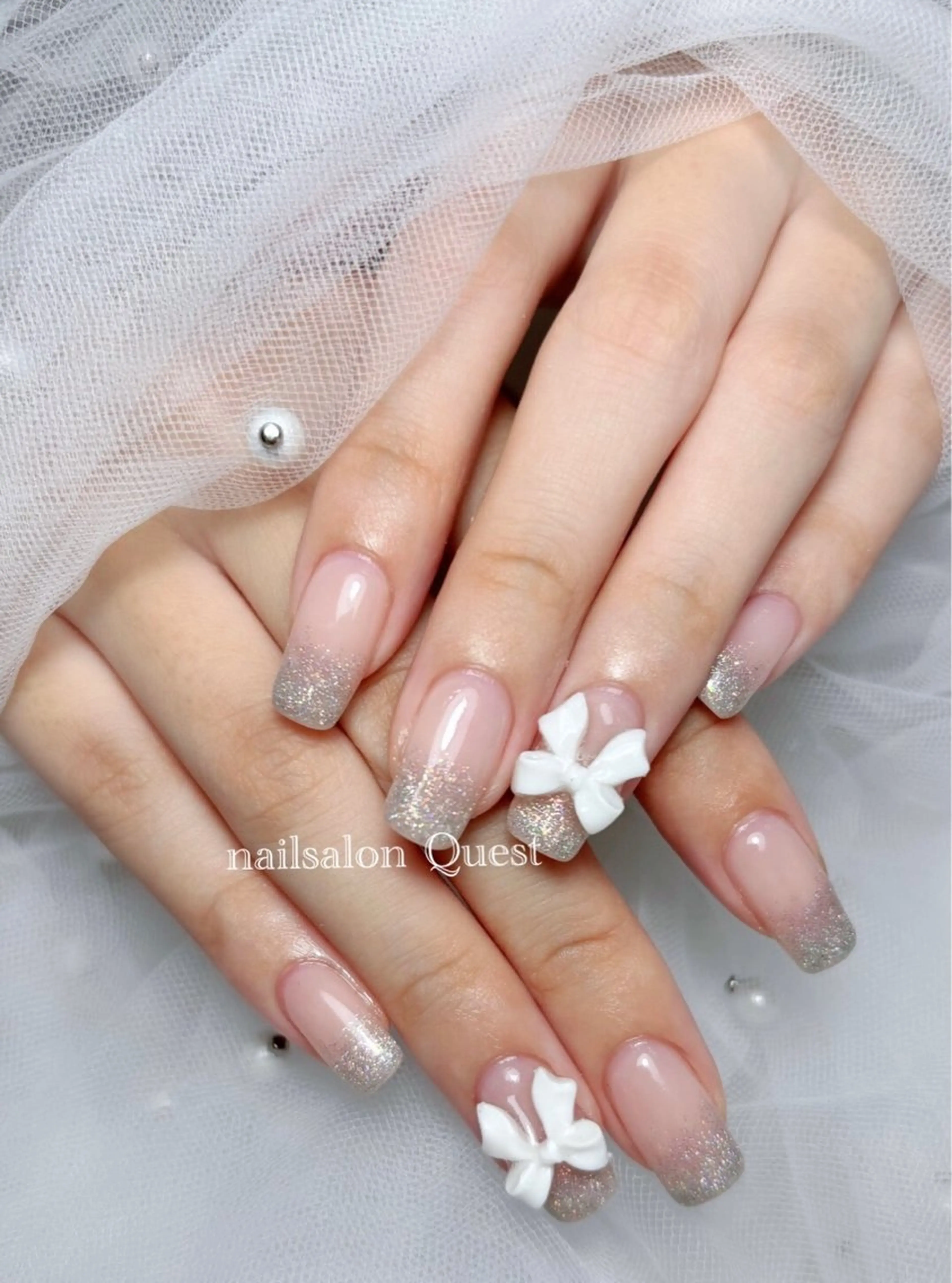 ネイル ガーリー グラデーション ラメ(グリッター) ラメグラデーション リボン nailsalon Questのネイルデザイン