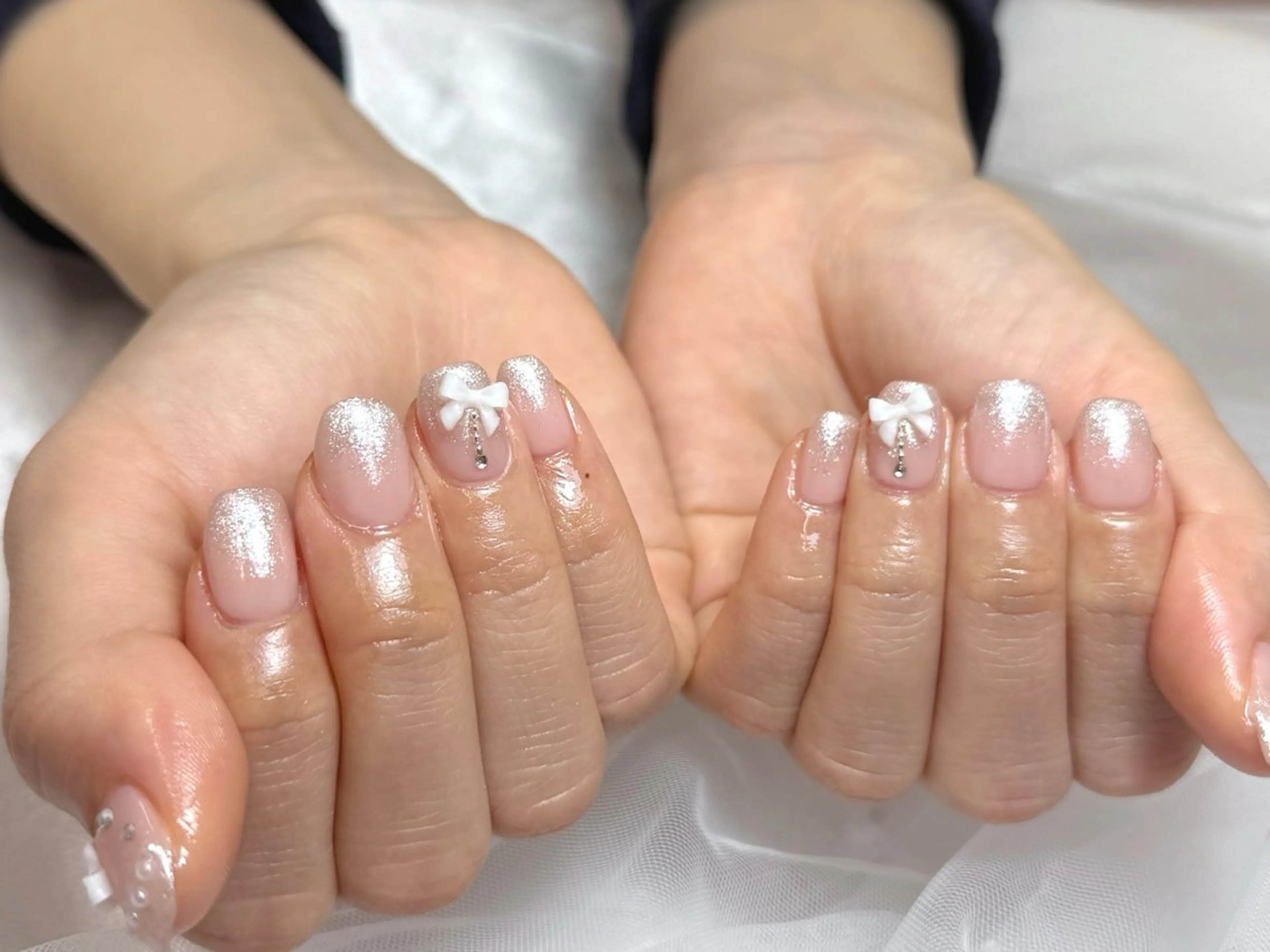 ネイル グラデーション ラメ(グリッター) ピンク ピンクベージュ リボン ハンドネイル bel fiore .のネイルデザイン