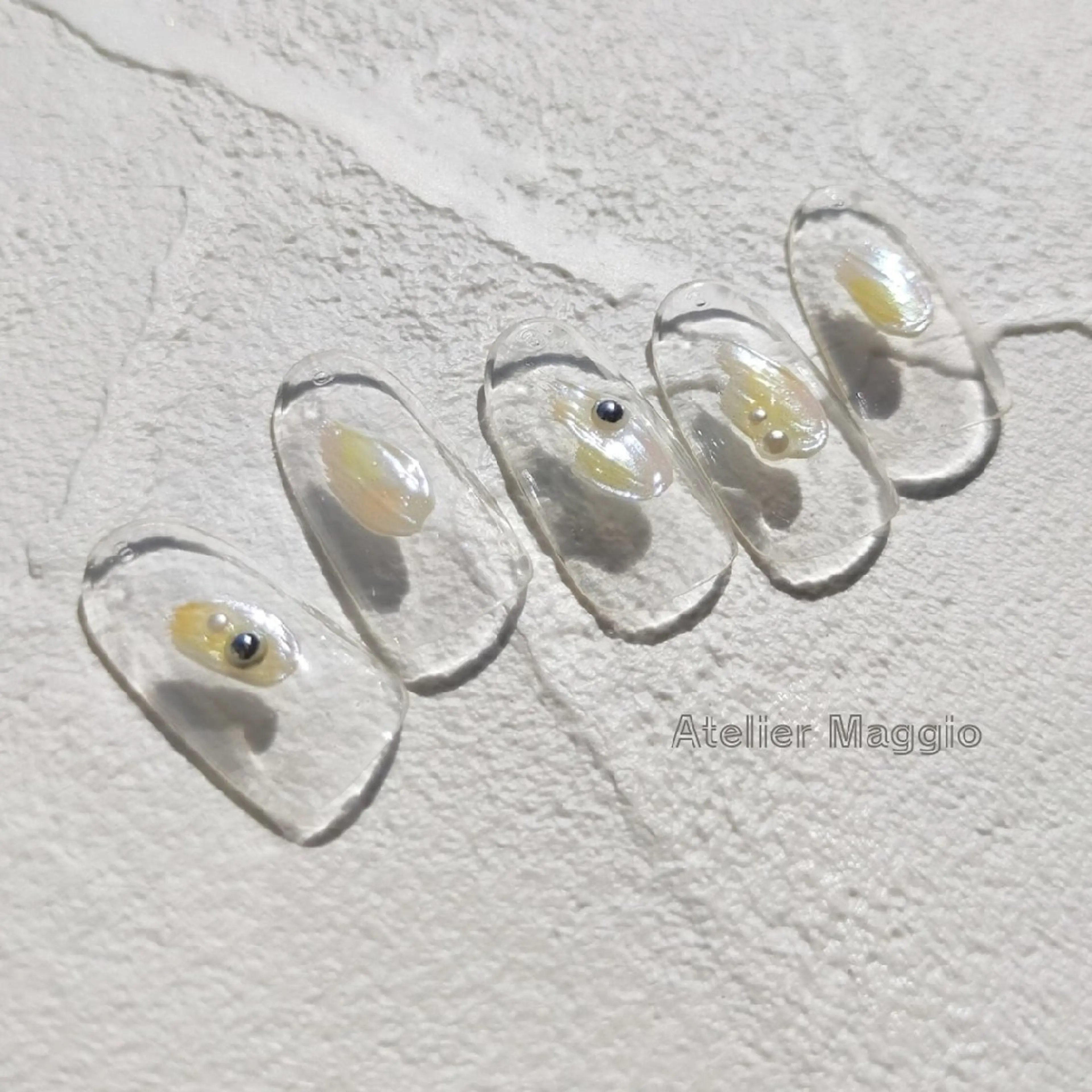 ネイル アートネイル オーロラネイル クリアネイル オレンジ 黄色 アトリエマッジョ madokaのネイルデザイン