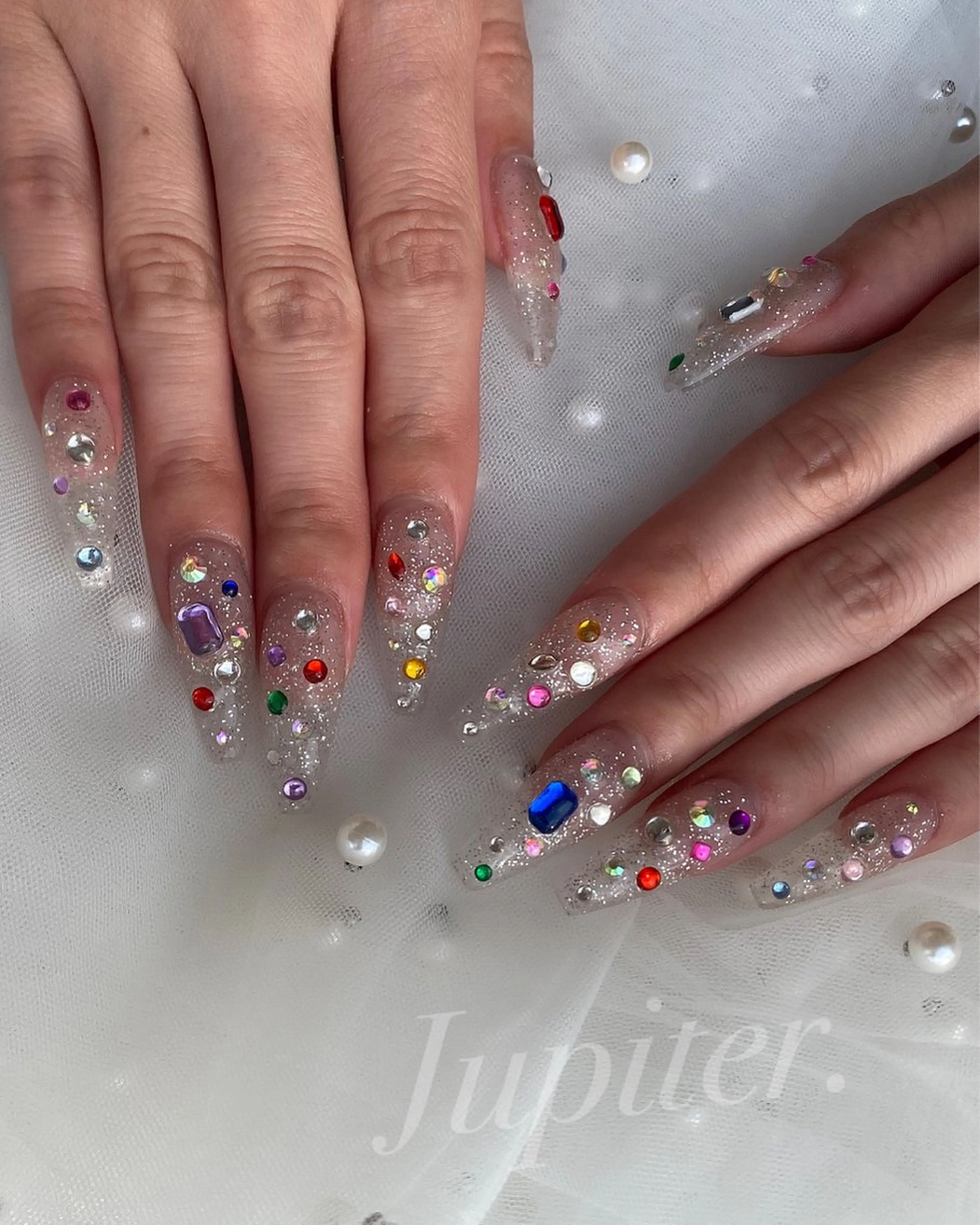 ネイル クリアネイル キラキラネイル スクエアネイル ストーンネイル ハンドネイル Jupiter .のネイルデザイン