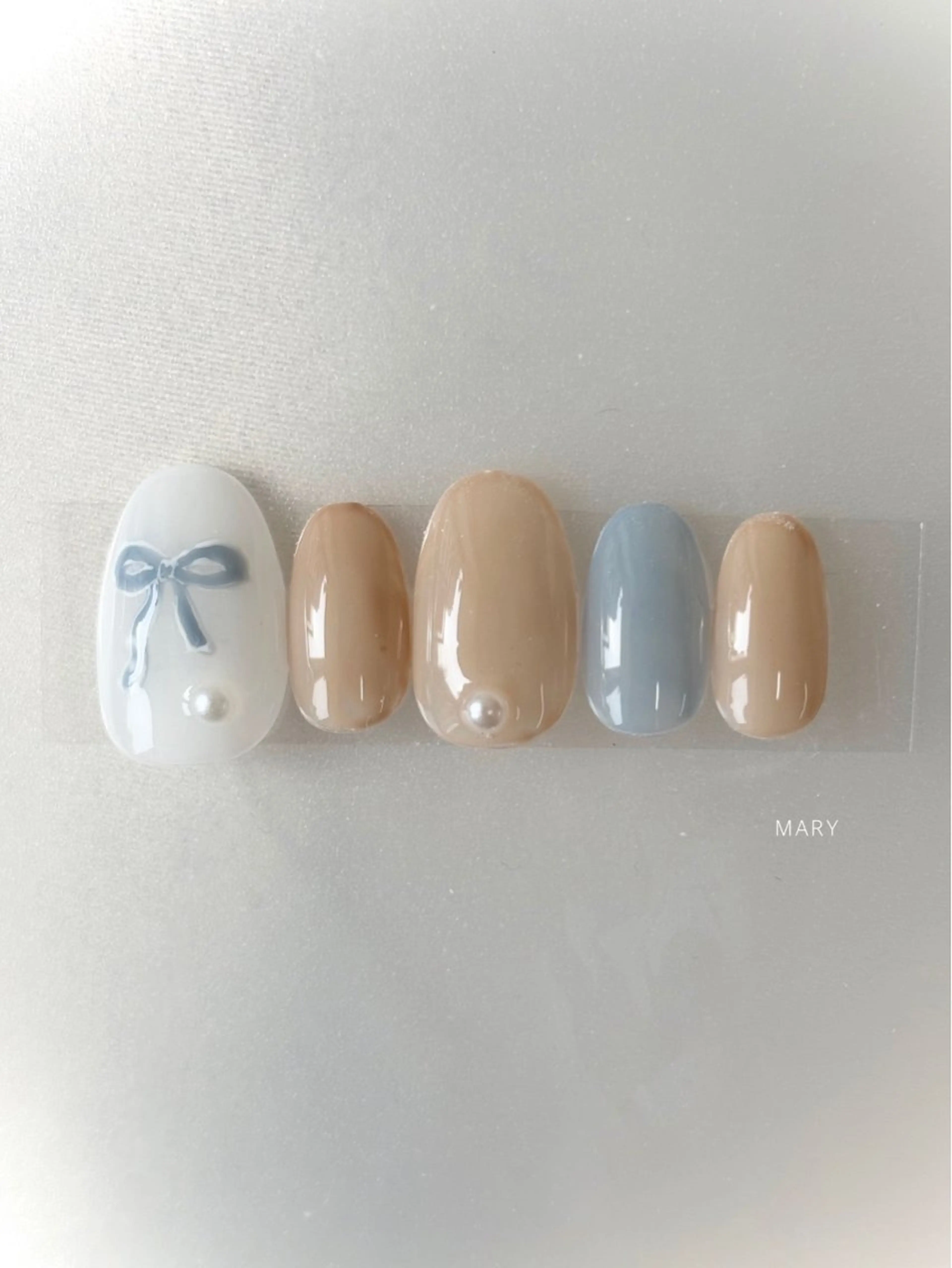 ネイル 水色 ニュアンスネイル リボン ハンドネイル Mary nail .narumiのネイルデザイン