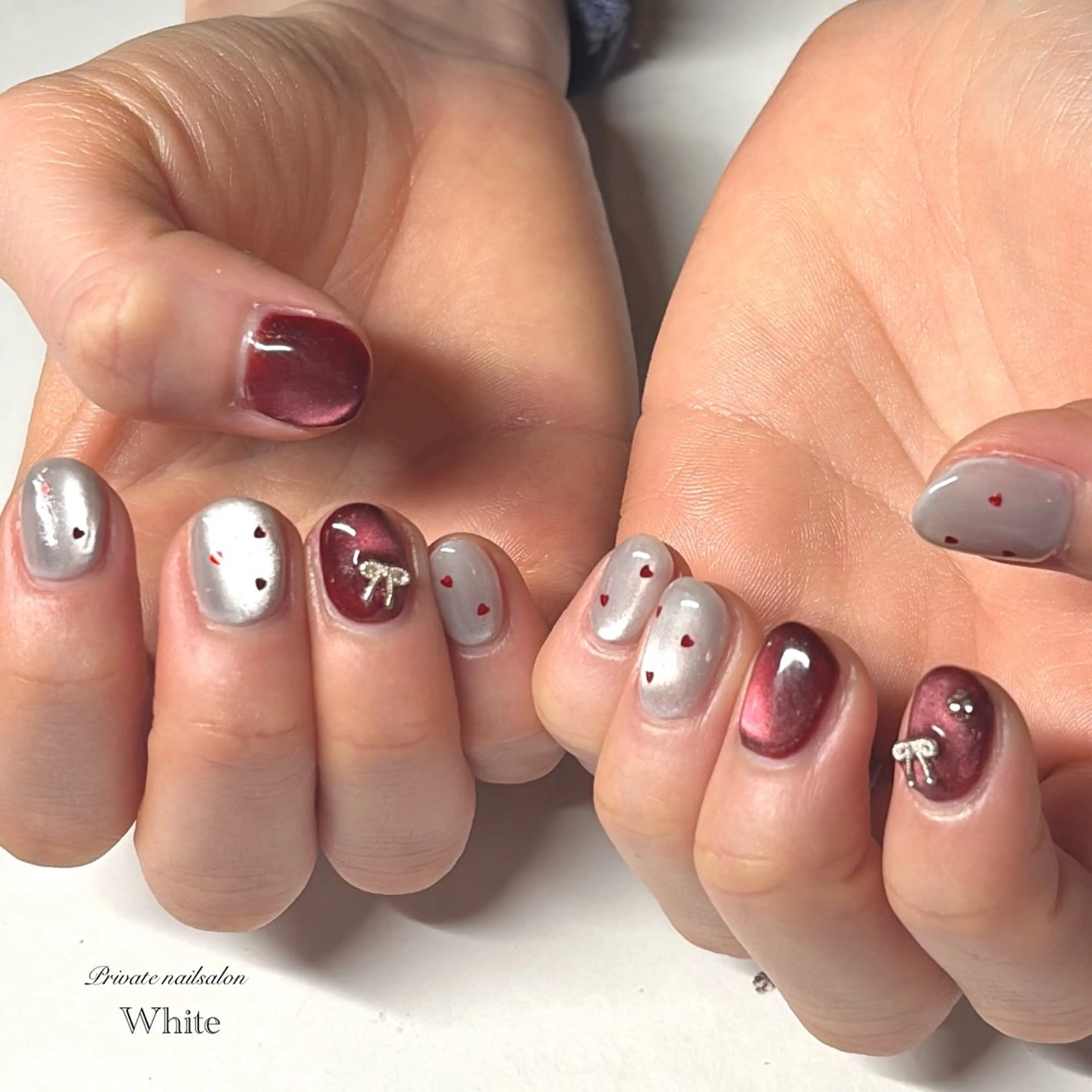 ネイル オーロラネイル ボルドー ハート マグネットネイル リボン ハンドネイル SAKASHITA KEIのネイルデザイン