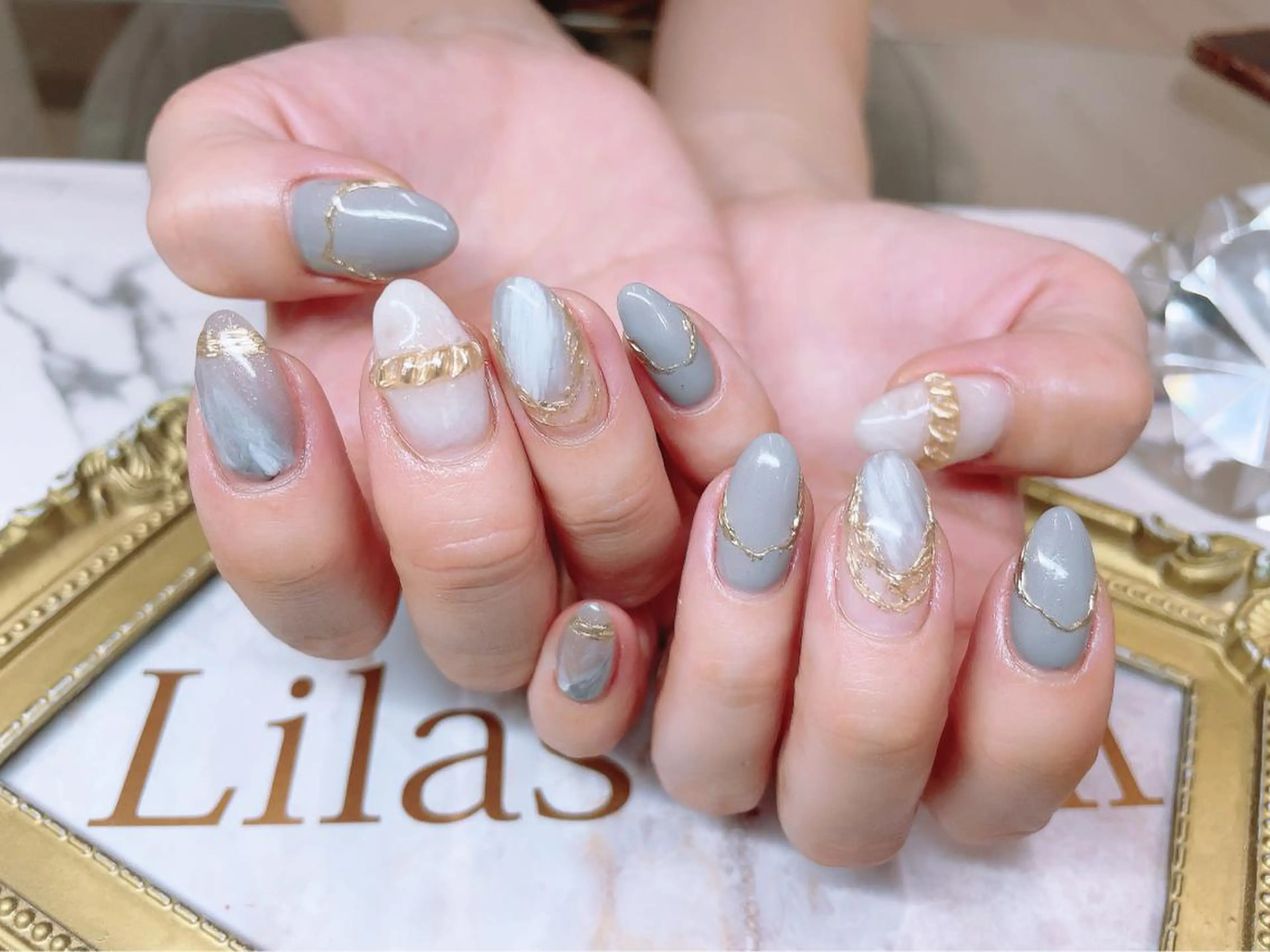 ネイル ジェルネイル ゴールド ハードジェル 水色 ロングネイル Lilas Nailのネイルデザイン