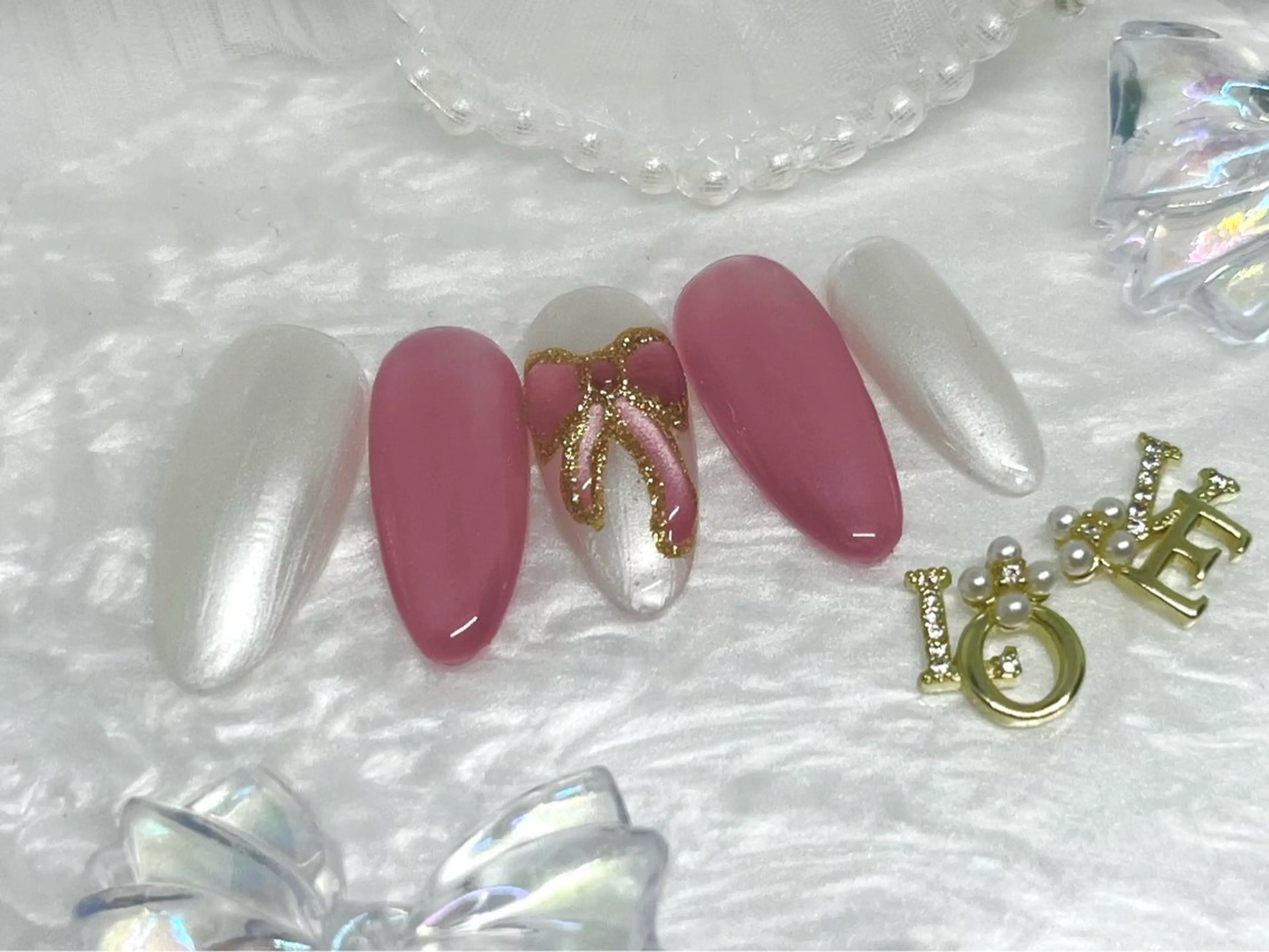 ネイル ゴールド ラメ(グリッター) リボン RIKA@salon newsproutのネイルデザイン