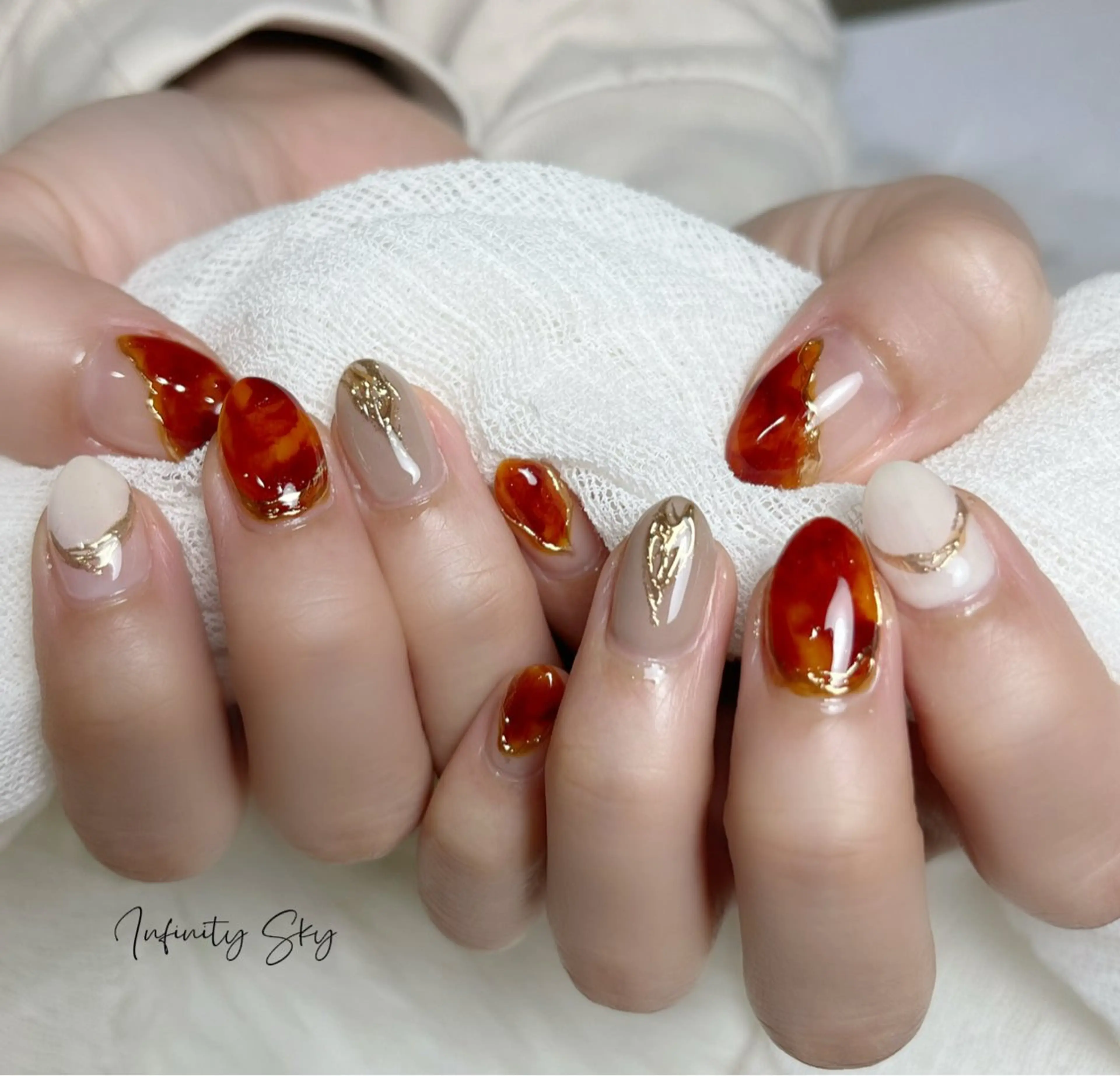 ネイル べっ甲ネイル infinity skyのネイルデザイン