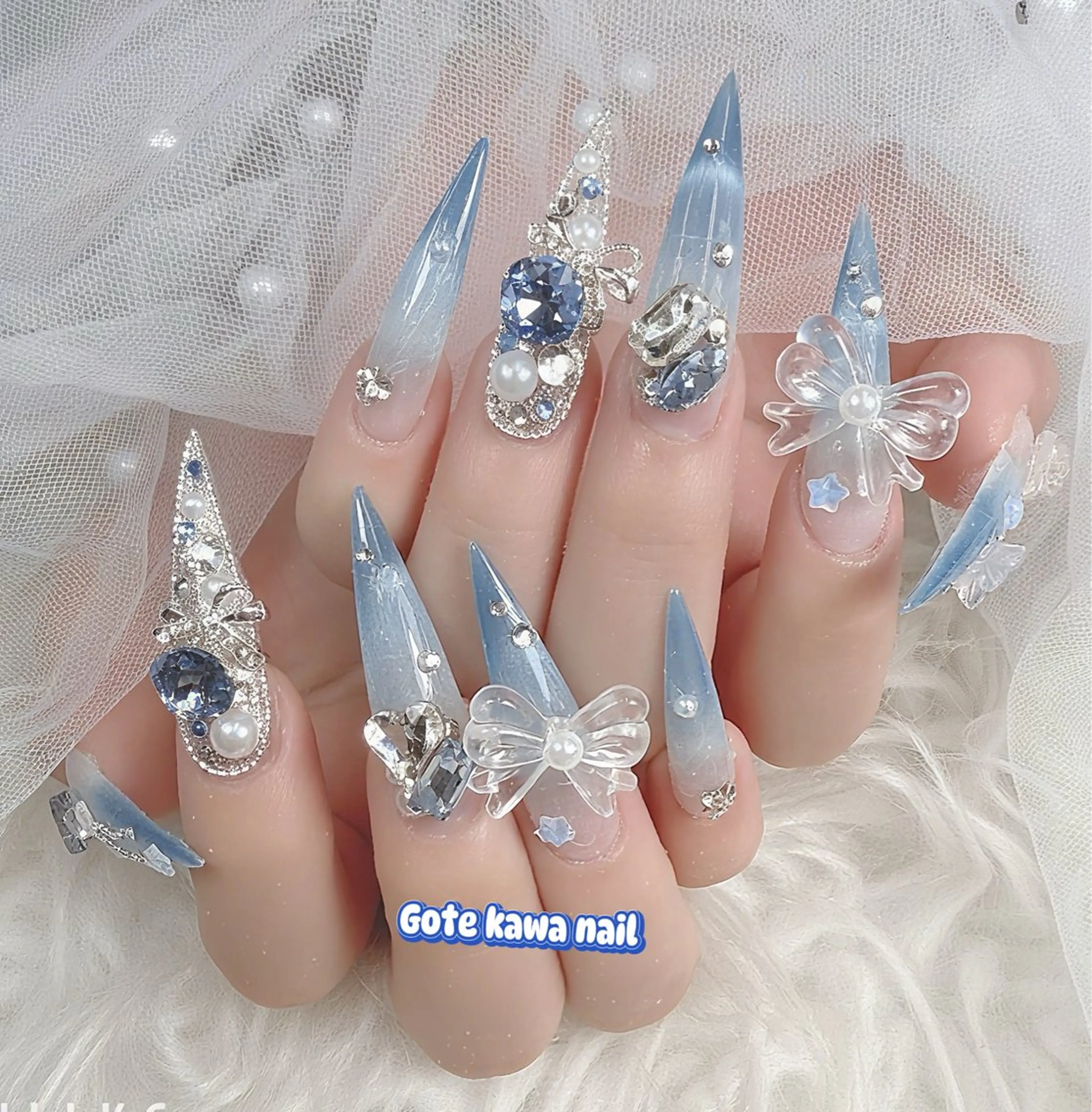 ネイル ブルー グラデーション 水色 マグネットネイル リボン ハンドネイル ハンドケア Gote Kawa nail salonのネイルデザイン