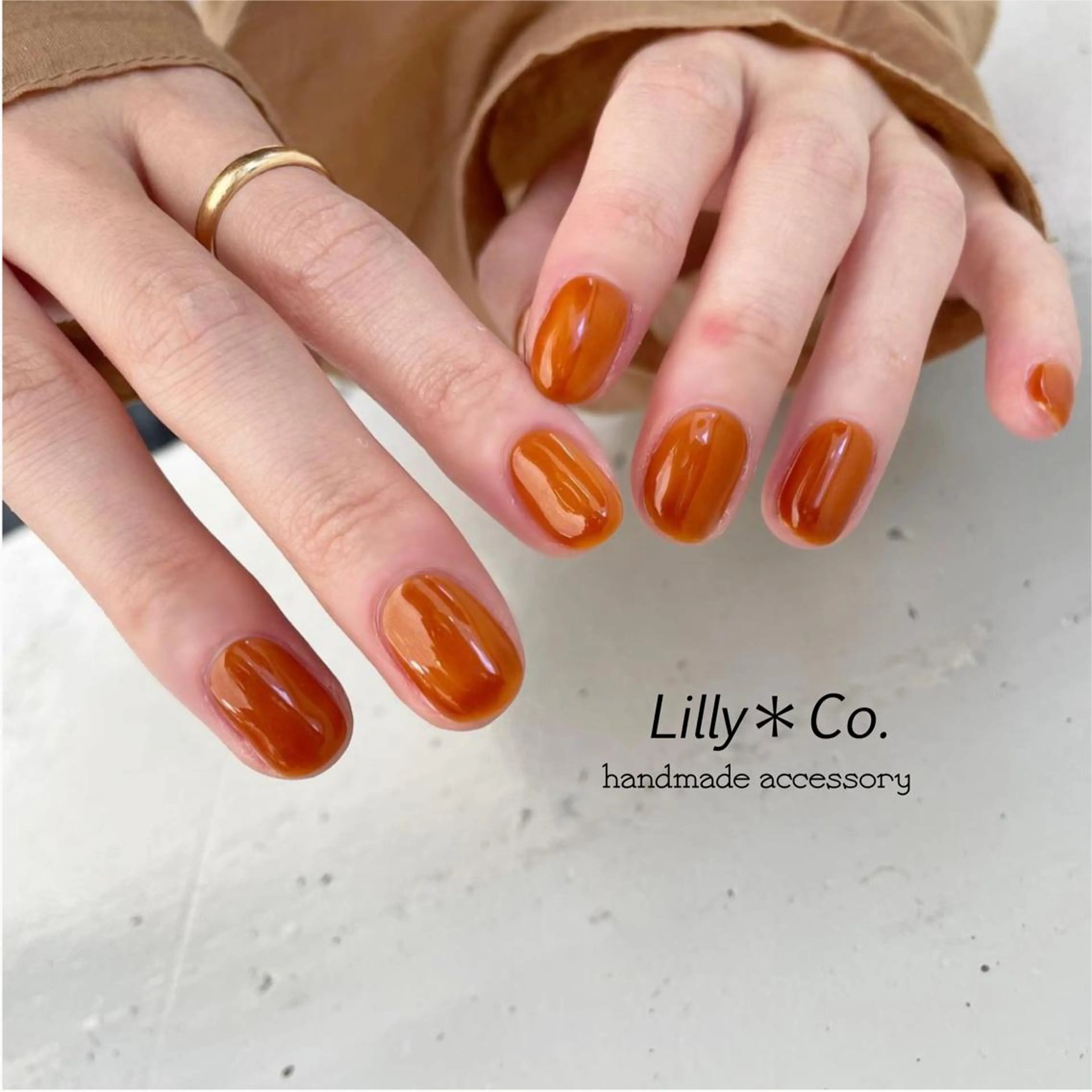 ネイル ジェルネイル ワンカラーネイル オレンジ ハンドネイル ハンドケア Lilly Co.のネイルデザイン