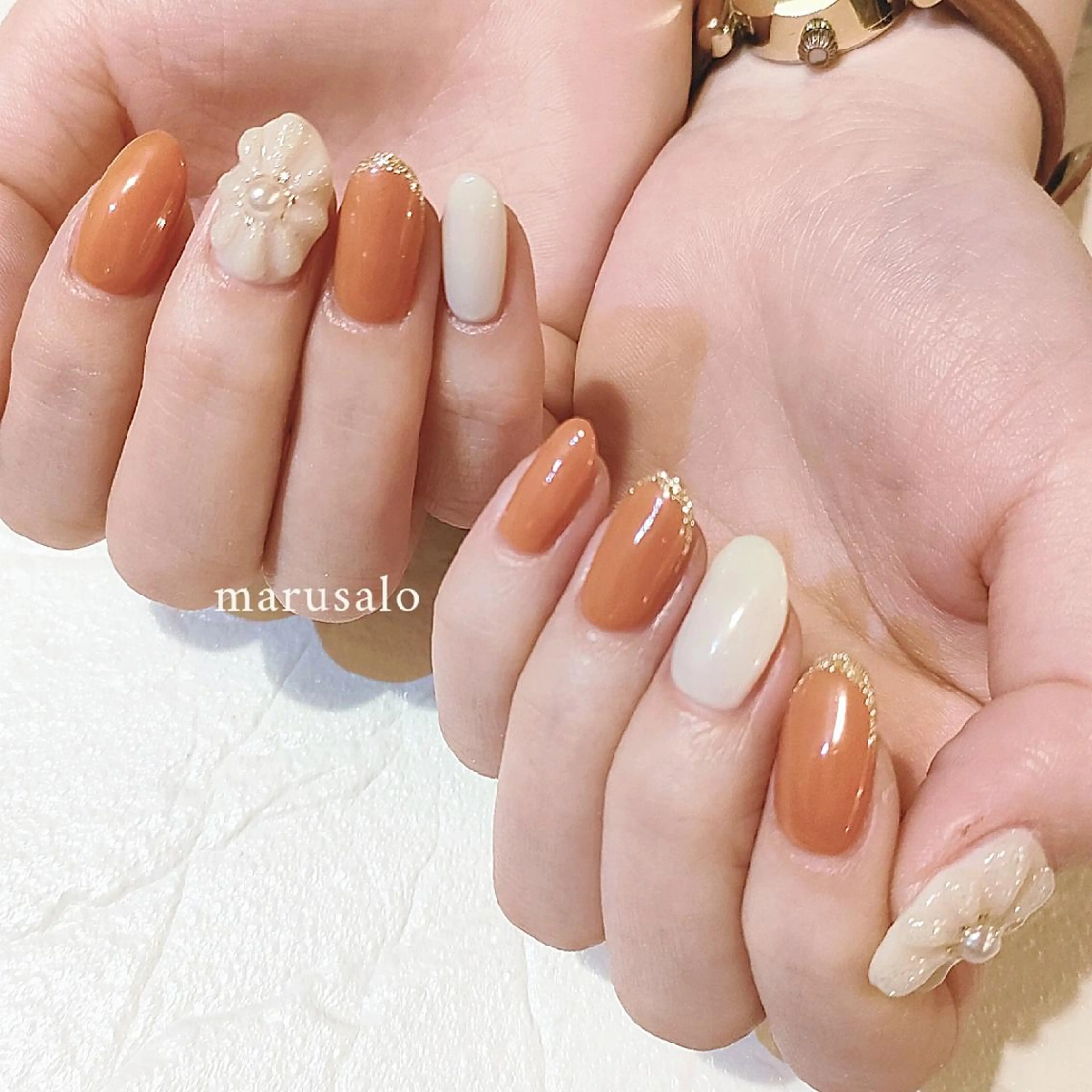 ネイル フラワーネイル フレンチネイル オレンジ ぷっくりネイル 冬ネイル ハンドネイル marusalo nailのネイルデザイン